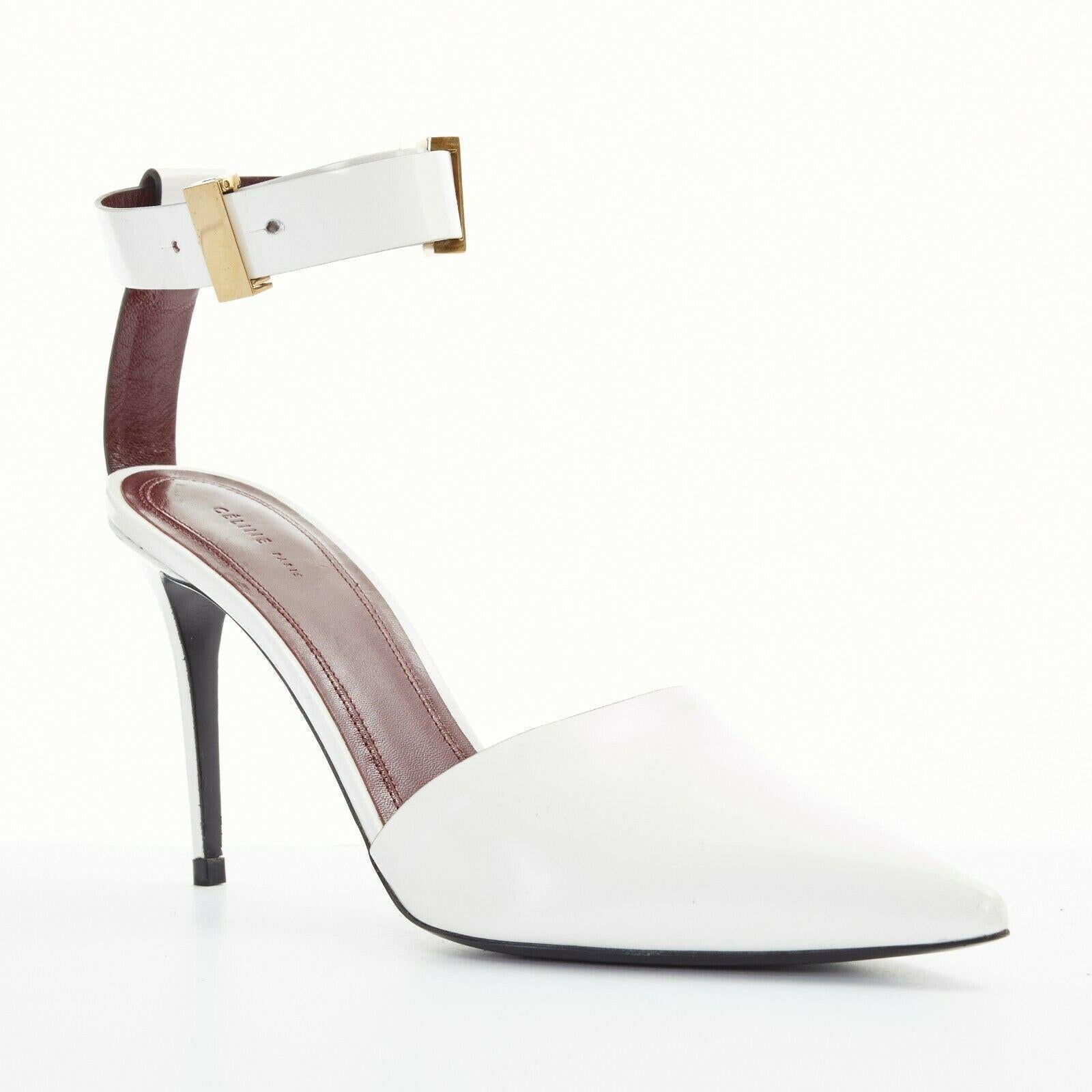 CELINE PHILO white leather point toe gold hardware ankle strap dorsay heel EU39 
Reference: TGAS/A02762 
Brand: Celine 
Designer: Phoebe Philo 
Material: Leather 
Color: White 
Pattern: Solid 
Closure: Ankle Strap 
Extra Detail: White glossy leather