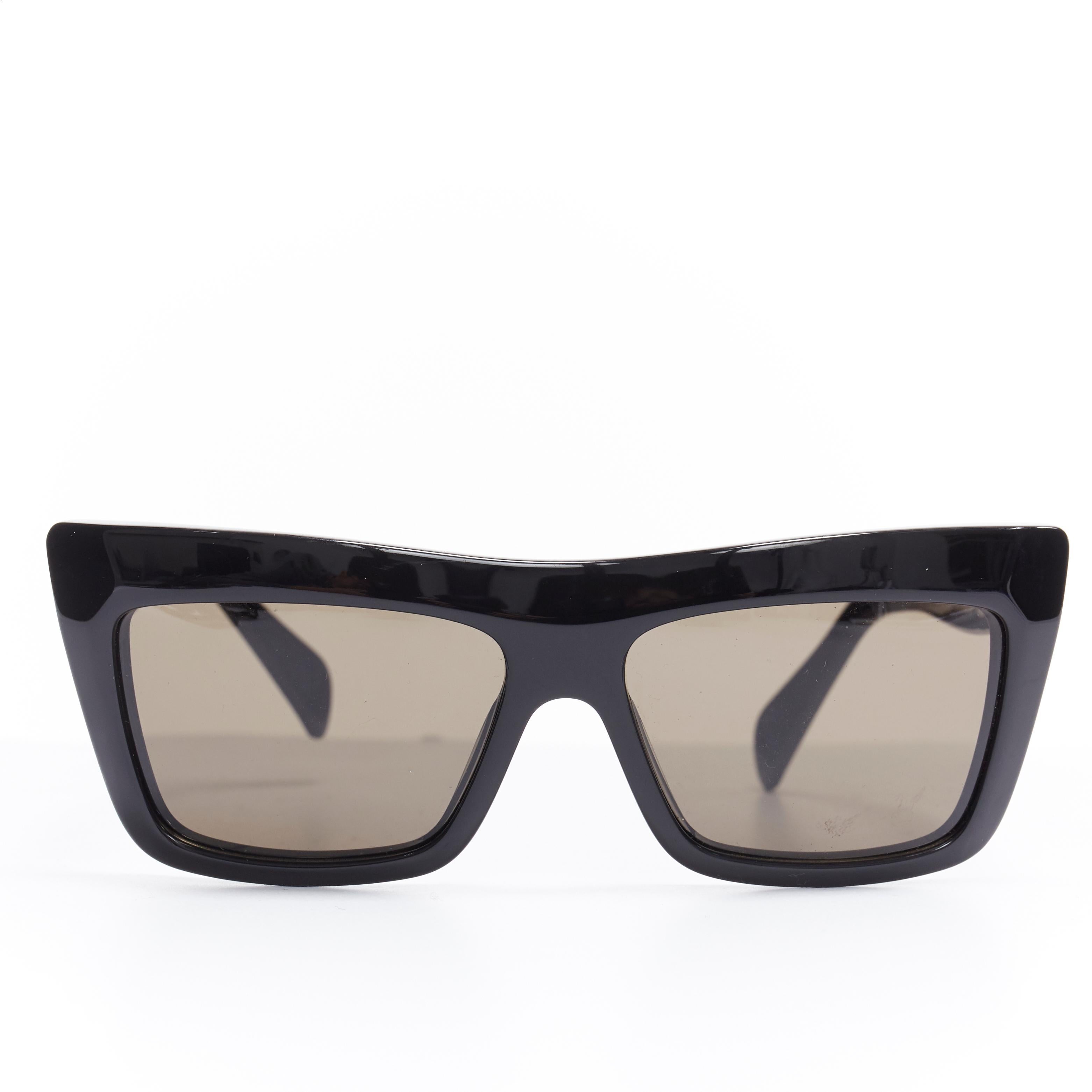 CELINE PHOEBE PHILO black angular thick frame grey lens sunglasses 
Reference: WEYN/A00346 
Brand: Celine 
Designer: Phoebe Philo 
Material: Plastic 
Color: Black 
Pattern: Solid 
Made in: Italy 

CONDITION: 
Condition: Very good, this item was