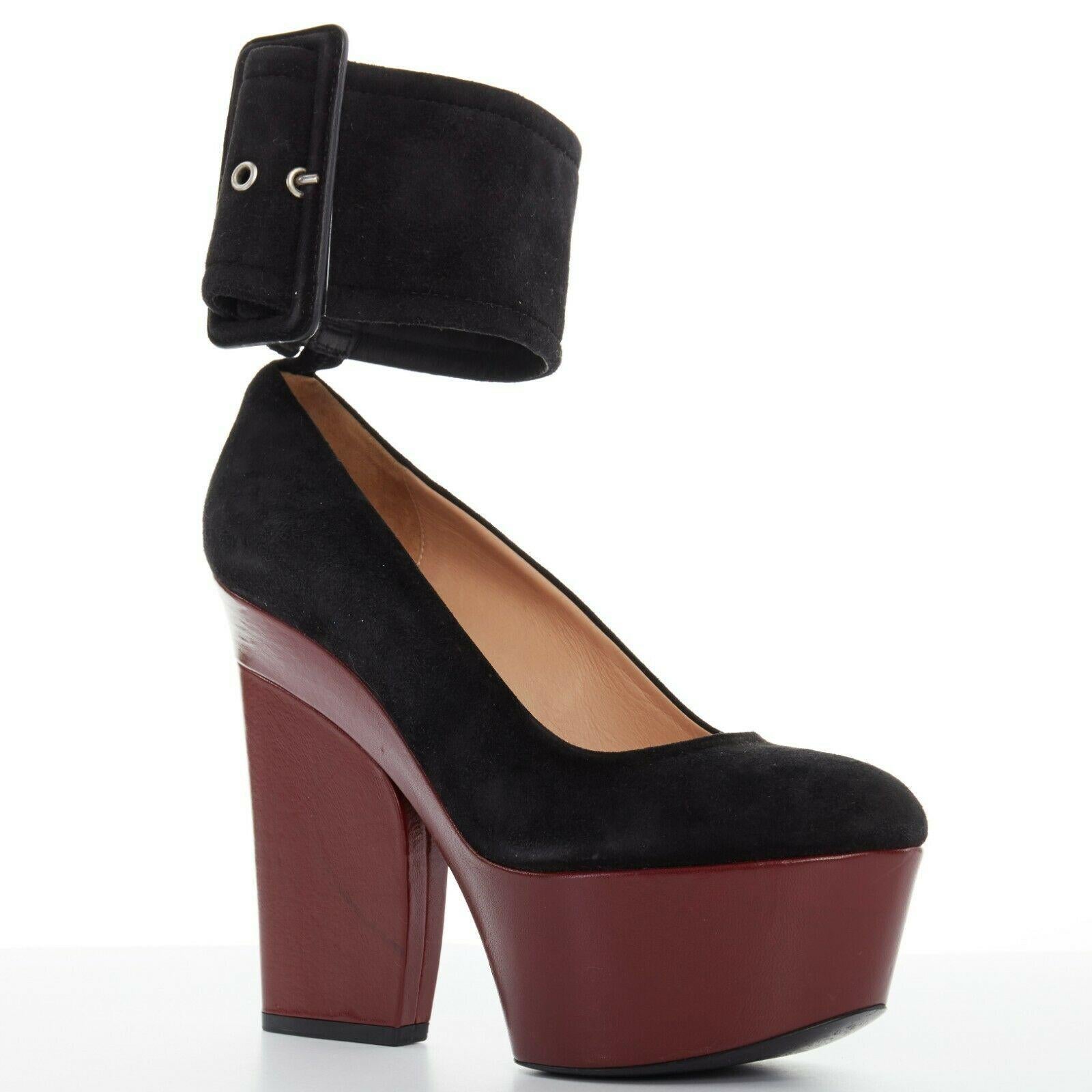 CELINE PHOEBE PHILO black suede red platform wedge wide ankle cuff heels EU38.5

CELINE BY PHOEBE PHILO
Black suede leather upper. Dark burgundy red leather covered platform heel. Almond round toe. Tonal stitching. Attached extra wide ankle cuff