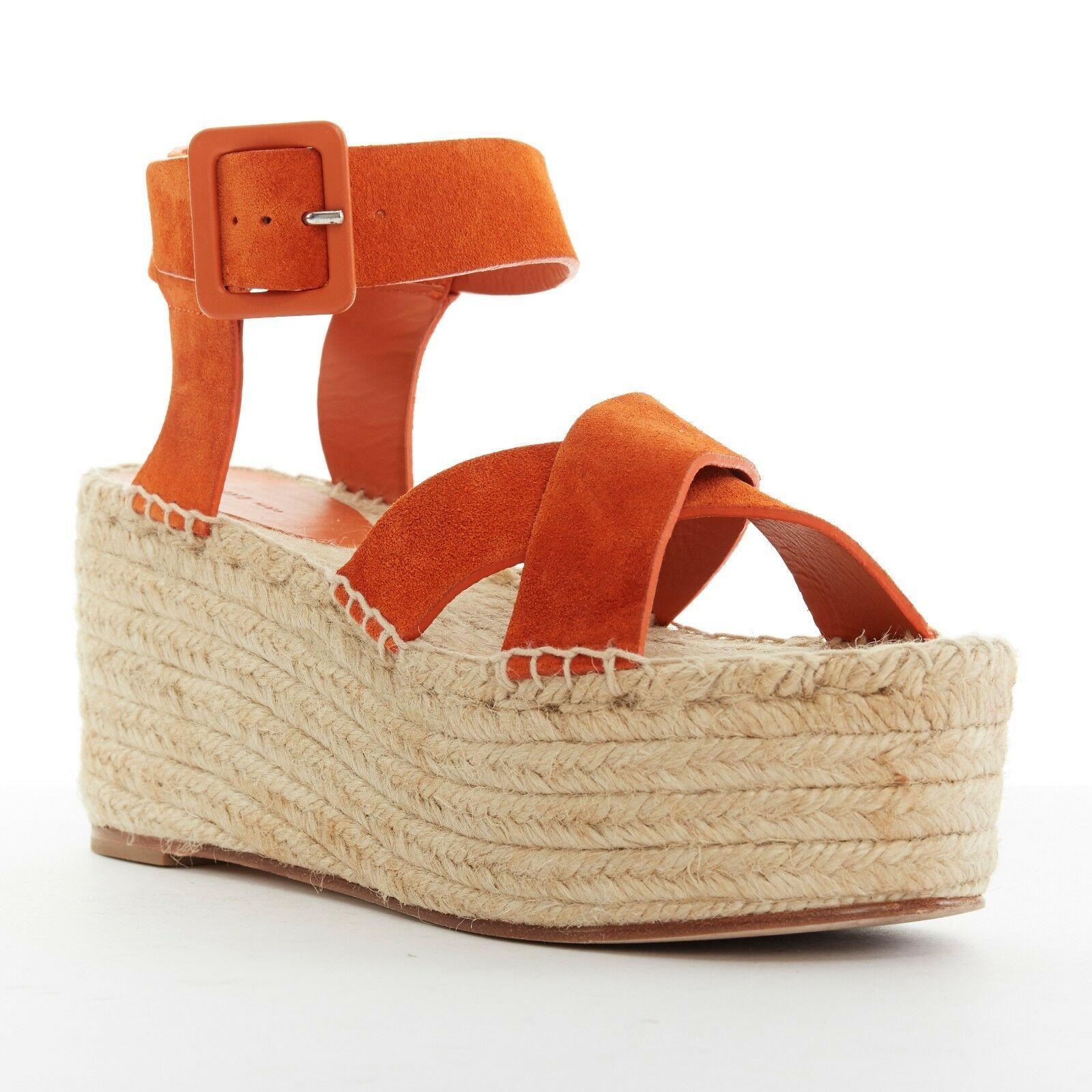 CELINE PHOEBE PHILO Criss Cross orange suede espadrille platform sandal EU38 US8

CELINE BY PHOEBE PHILO
Criss Cross sandals. Orange suede leather upper. Espadrille platform sole. Criss cross strap. Open toe. Ankle strap. Leather wrapped buckle