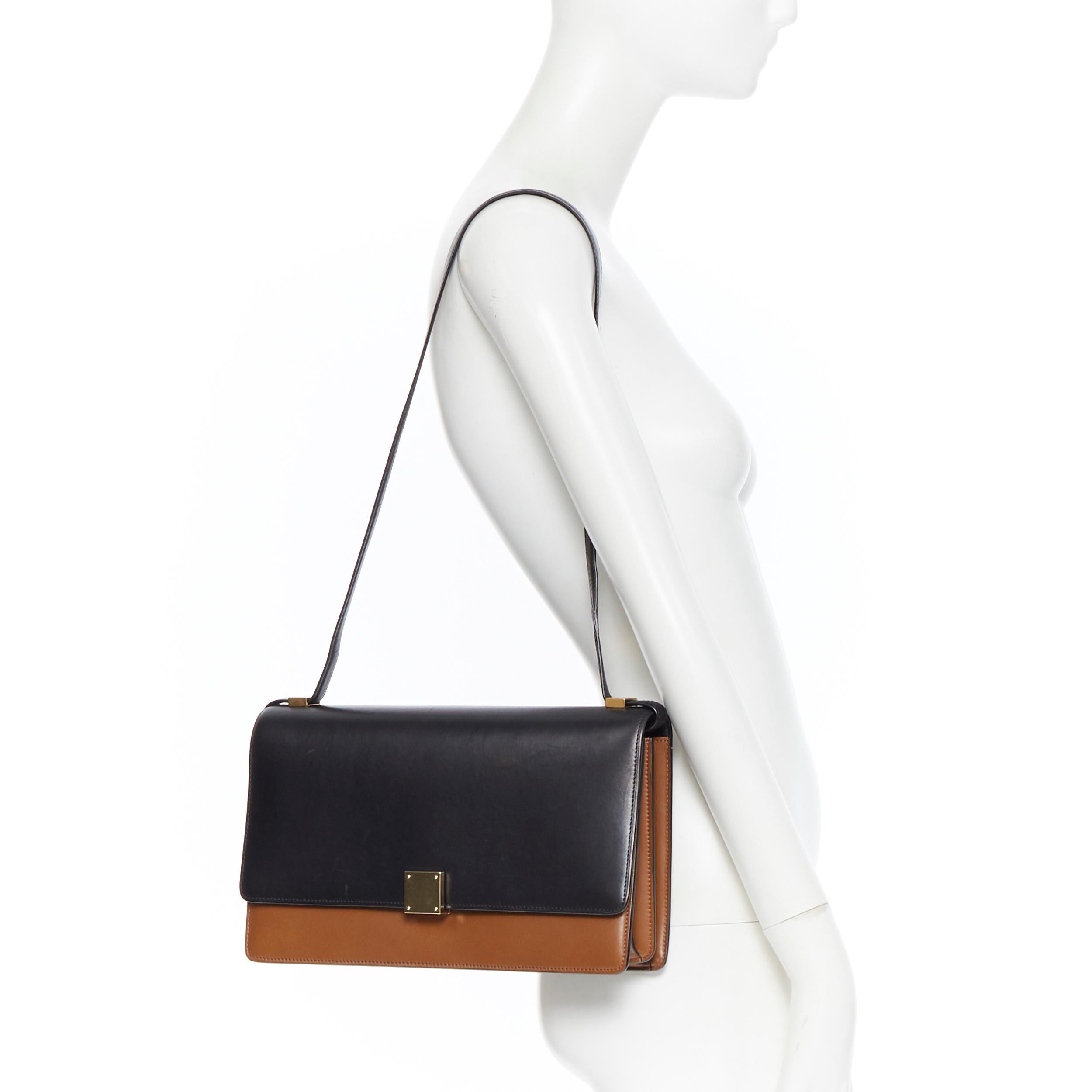 CELINE PHOEBE PHILO Medium Case Flap black brown calf lock long shoulder bag
Brand: Celine
Designer: Phoebe Philo
Model Name / Style: Medium Case Flap
Material: Leather; calf leather
Color: Black and brown
Pattern: Solid
Closure: Turnlock
Extra