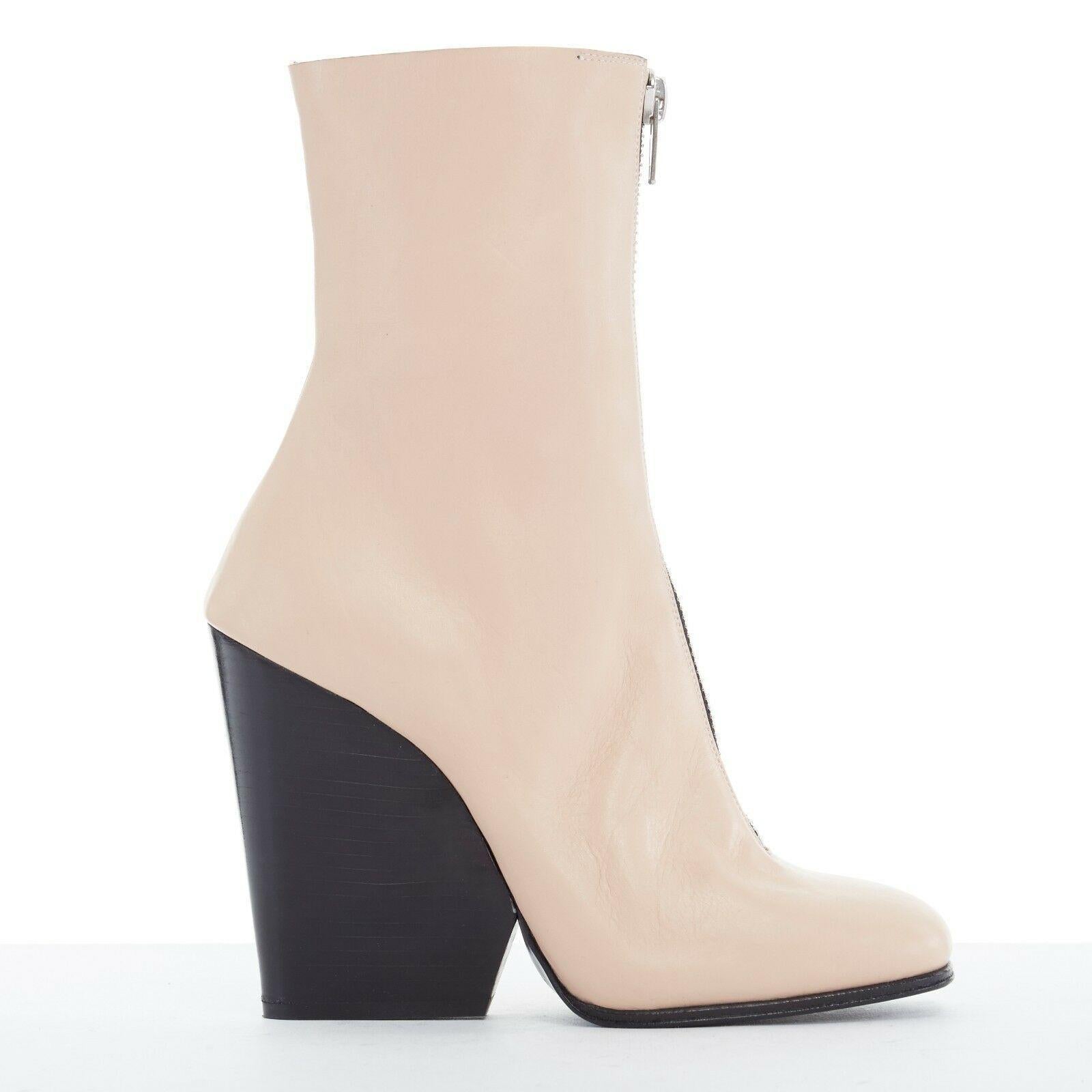 CELINE PHOEBE PHILO nude beige leather zip front square toe wedge boot shoe EU36

CELINE BY PHOEBE PHILO
Beige leather upper. Exposed zip front closure. Square toe. Black stacked wooden wedge heel. Ankle boots. Made in Italy

CONDITION
Good, this