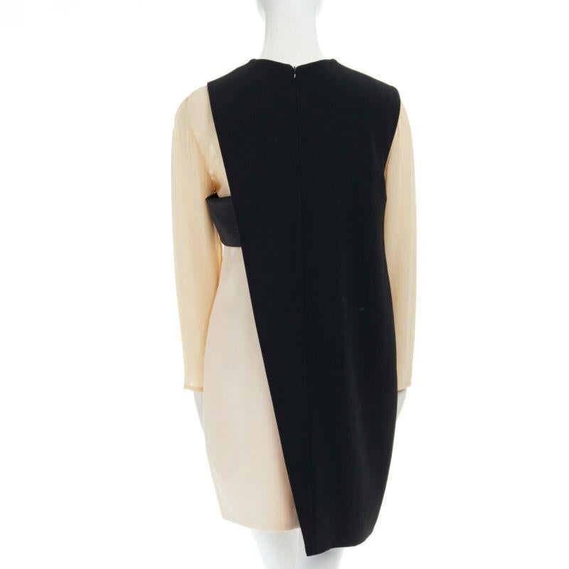 CELINE Phoebe Philo nude black asymmetric layered silk sleeve shift dress FR38
Reference: CC/YEHO00229
Brand: Celine
Designer: Phoebe Philo
Color: Black, Nude
Pattern: Other
Closure: Zip
Extra Details: Nude and black. Faux layered design. Round