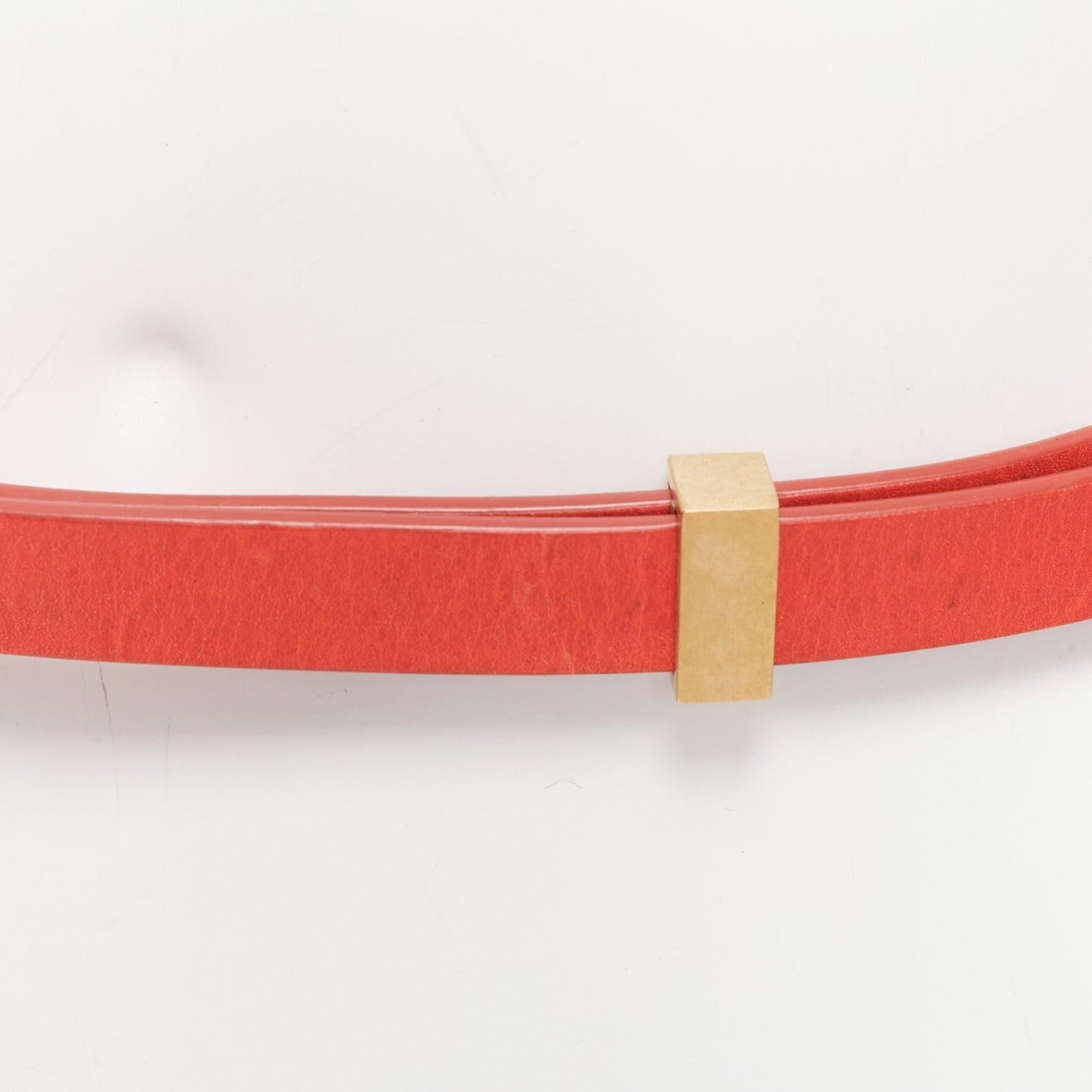 CELINE Phoebe Philo red smooth leather gold metal bar skinny belt XS
Reference: AAWC/A01196
Brand: Celine
Designer: Phoebe Philo
Material: Leather, Metal
Color: Red, Gold
Pattern: Solid
Closure: Belt
Lining: Red Leather
Extra Details: Slightly
