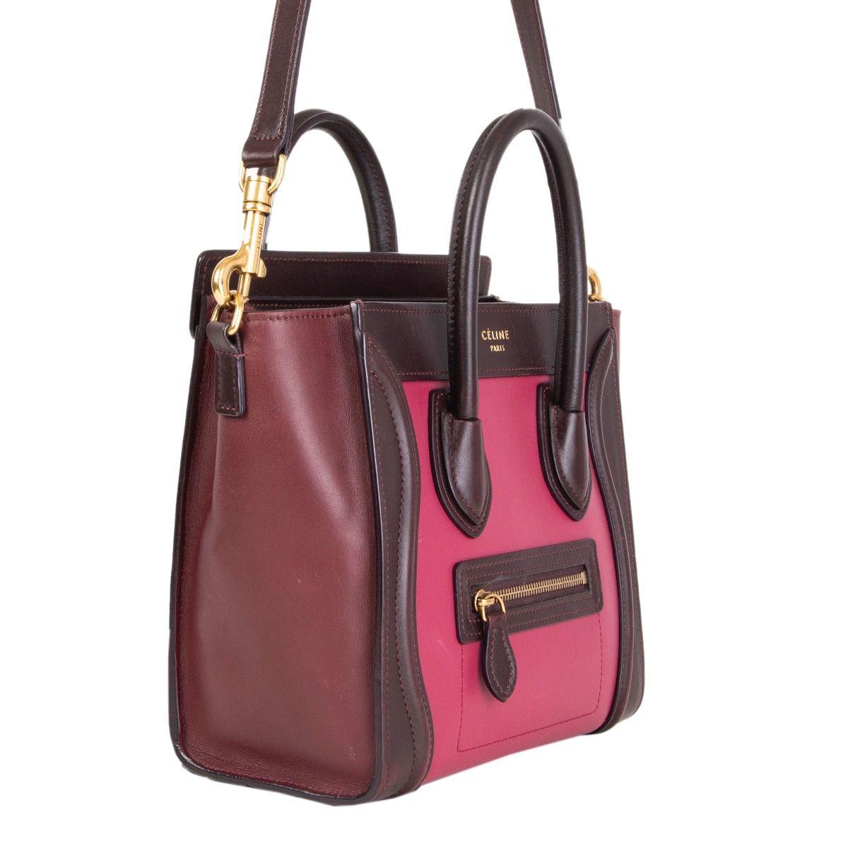 Céline 'Nano Luggage' cross body tote bag in magenta, maroon and burgundy calfskin featuring zipped outside pocket. Opens with a zipper on top and is lined in maroon calfskin with one open pocket against the back. Detachabel shoulder strap. Has been