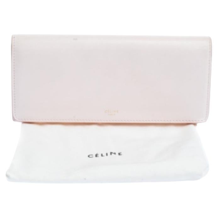 This splendor of a wallet from the house of Celine is meticulously crafted from leather and designed with its brand logo on the front. Styled with a flap, the wallet is equipped with multiple slots and a zip compartment to carry your necessities.
