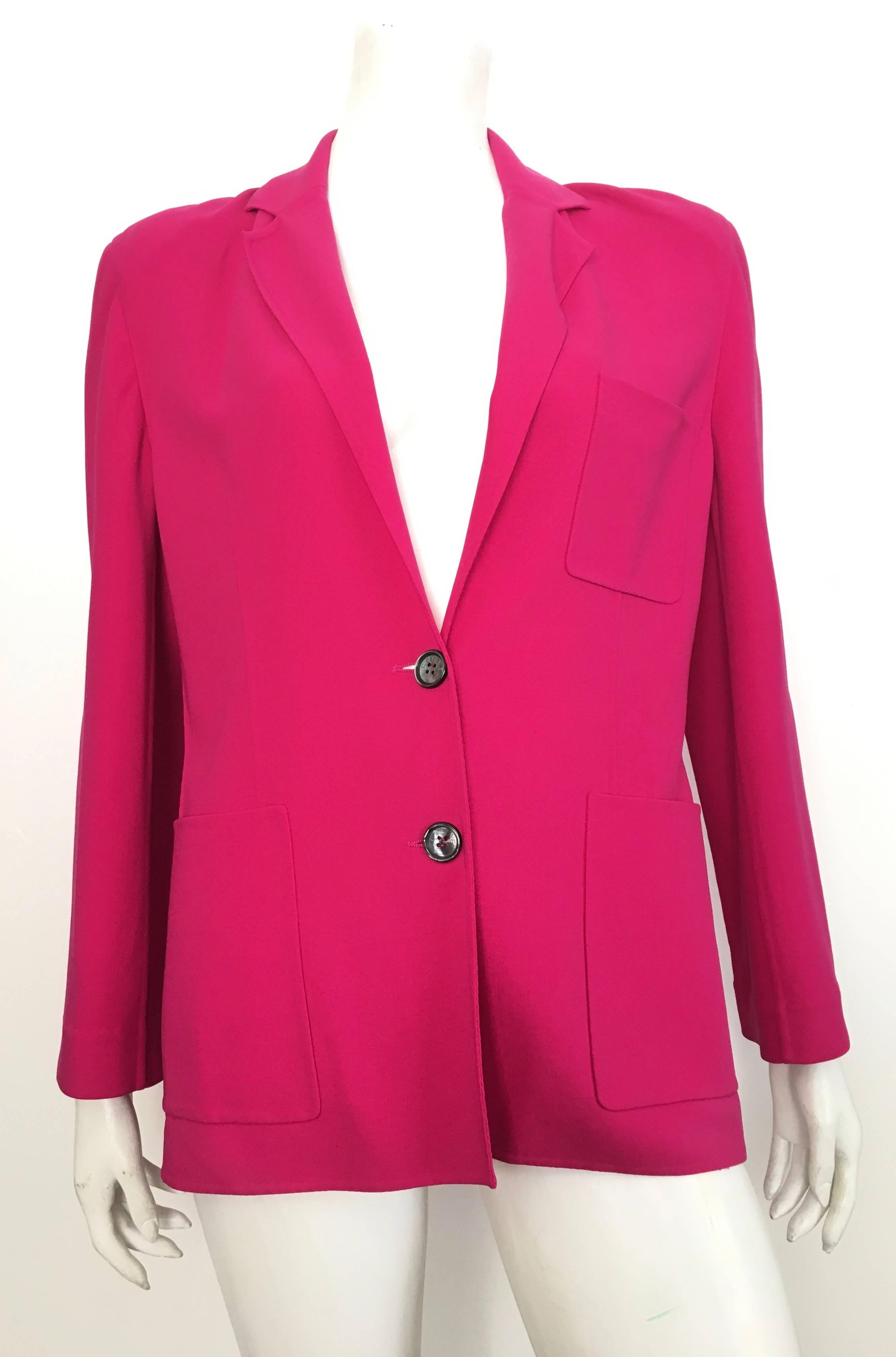 Celine pink wool two button jacket with pockets is a French size 42 and fits an USA size 8.  This Celine jacket is the only jacket you will need for spring / summer.  The color is very bold and very powerful, this is a statement piece to add to any