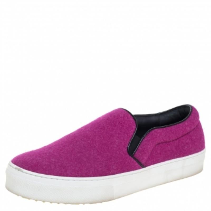 Make an amazing style statement in these slip-on sneakers from Celine. They have been crafted from pink wool and styled with round toes. They come equipped with comfortable leather-lined insoles and thick rubber soles. Grab them right away!