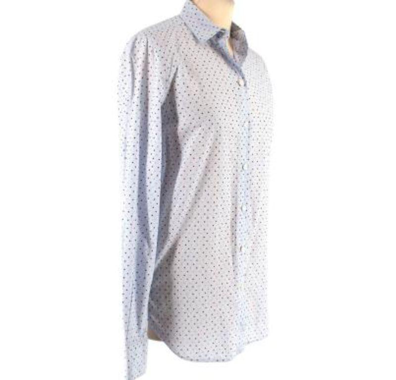 Celine Polka Dot Blue Shirt

- Blue striped with multi-color polka dots 
- Button fastening to the front
- Cuff buttons
- Slim fit

Material
100% Cotton
Made in Madagascar

9.5/10 Excellent Condition

PLEASE NOTE, THESE ITEMS ARE PRE-OWNED AND MAY