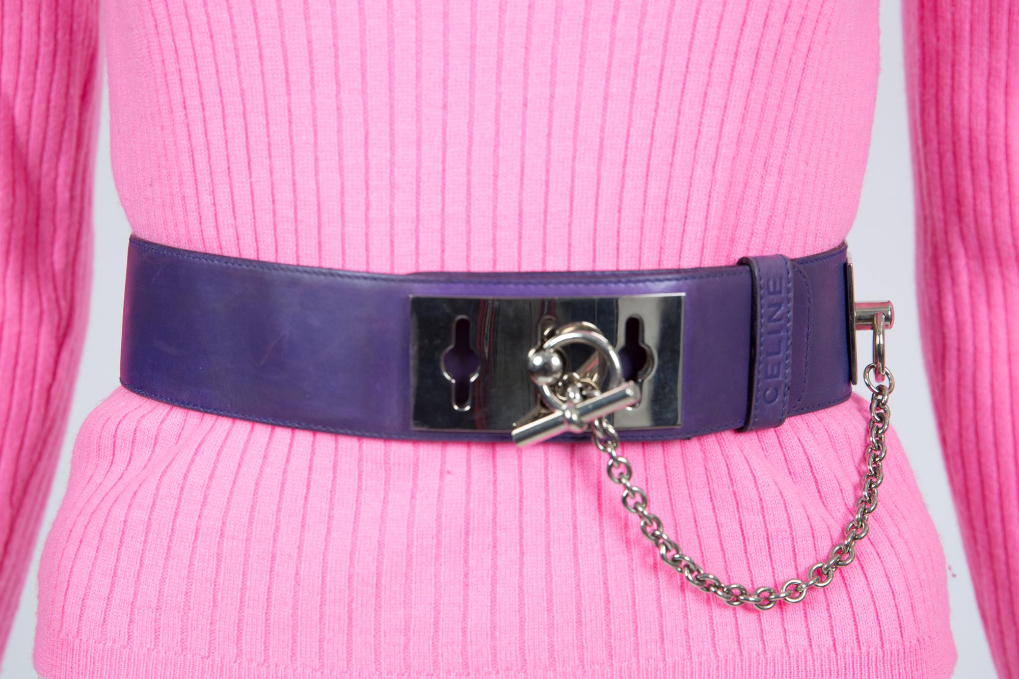 Celine large purple leather belt featuring a toggle waist chain detail, silver-tone hardware, a logo pitted on the loop, an inside logo stamp. 
Size stamp: 65
Circa:2000s
Length Maxi: 32.2in. (82cm)
Widtht: 1.9in. (5cm)
In good vintage condition.