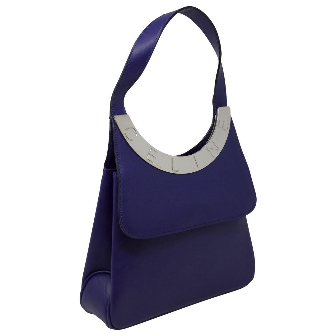 This one is so unique and rare! We love the sihlouette and the CELINE logo stamped on the silver plate! SO SLEEK! Also the purple color is so interesting and beautiful. Crafted in purple leather, silver-tone hardware, a flat single shoulder strap,