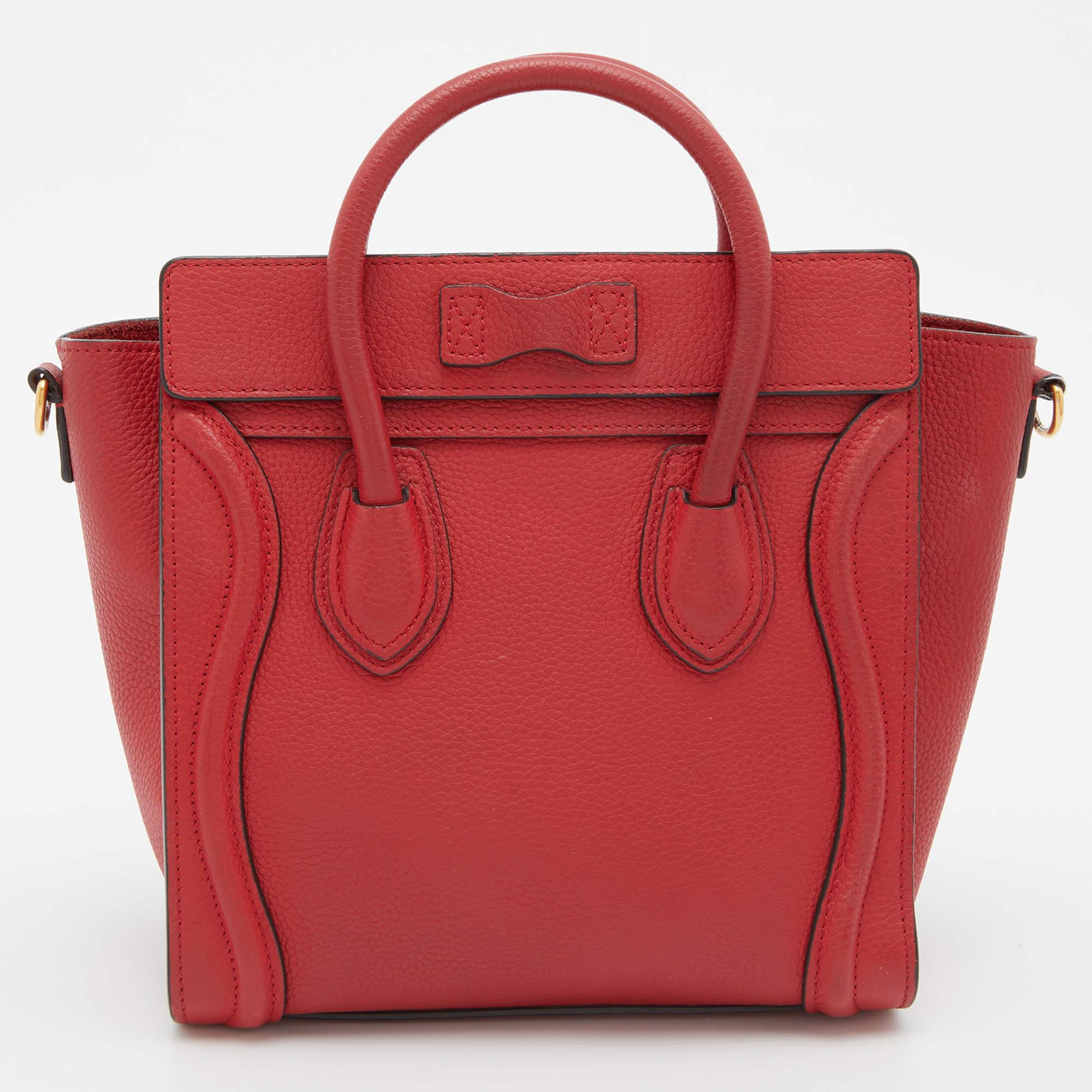 This adorable Nano Luggage tote from Celine is a popular design. The red tote is crafted from grain leather and features signature flappy wings. It comes with rolled top handles, a front zip pocket, and a detachable shoulder strap.

Includes: