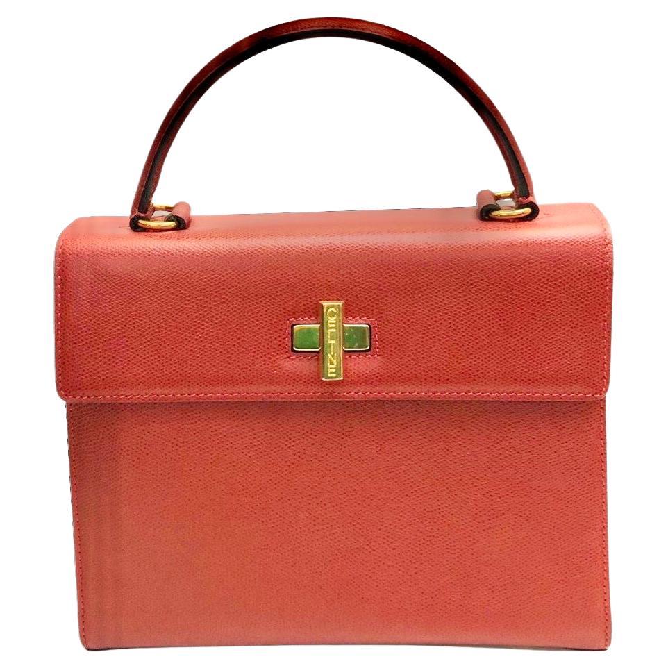 - Vintage Celine red leather box handbag.

- Gold hardware “CELINE” turn-lock closure. 

- Red leather interior. 

- One interior zip pocket.Two interior slip  pockets. 

- Size: 26cm x 20cm x 9.5 cm. Handle Drop: 12cm. 

- Excellent condition: