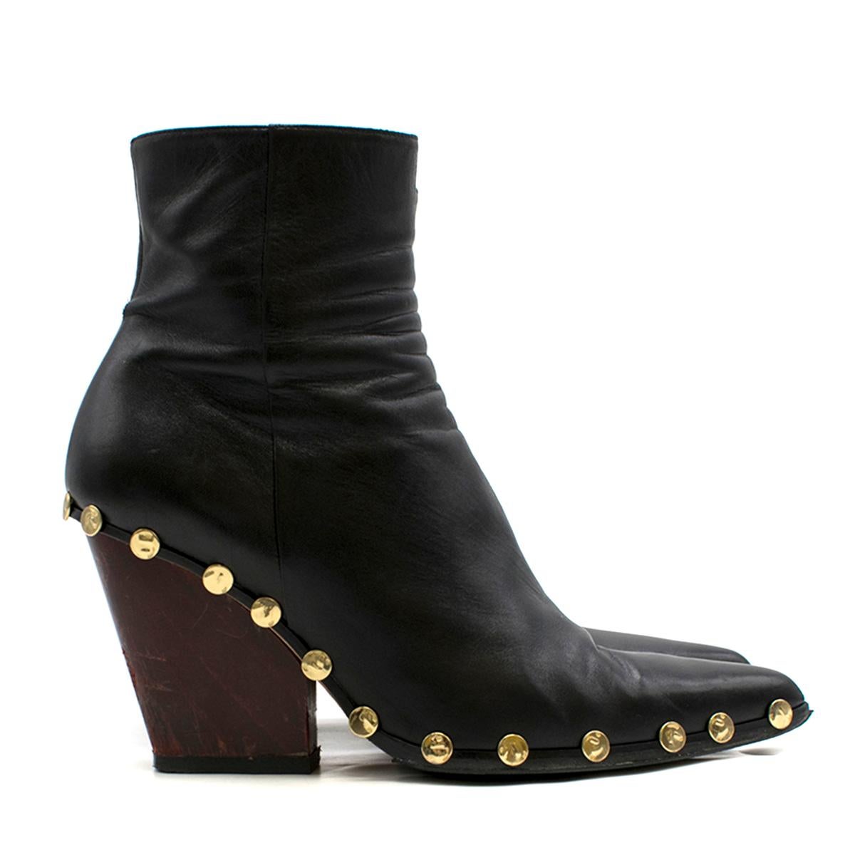 Celine Rodeo High Ankle Boot with Studs

- Smooth shiny black leather ankle boots
- Chunky red block heel
- Pointed toes
- Side zip fastening 
- Hammered gold-tone metal studded midsole trim 
- This item comes with an alternative brand dust