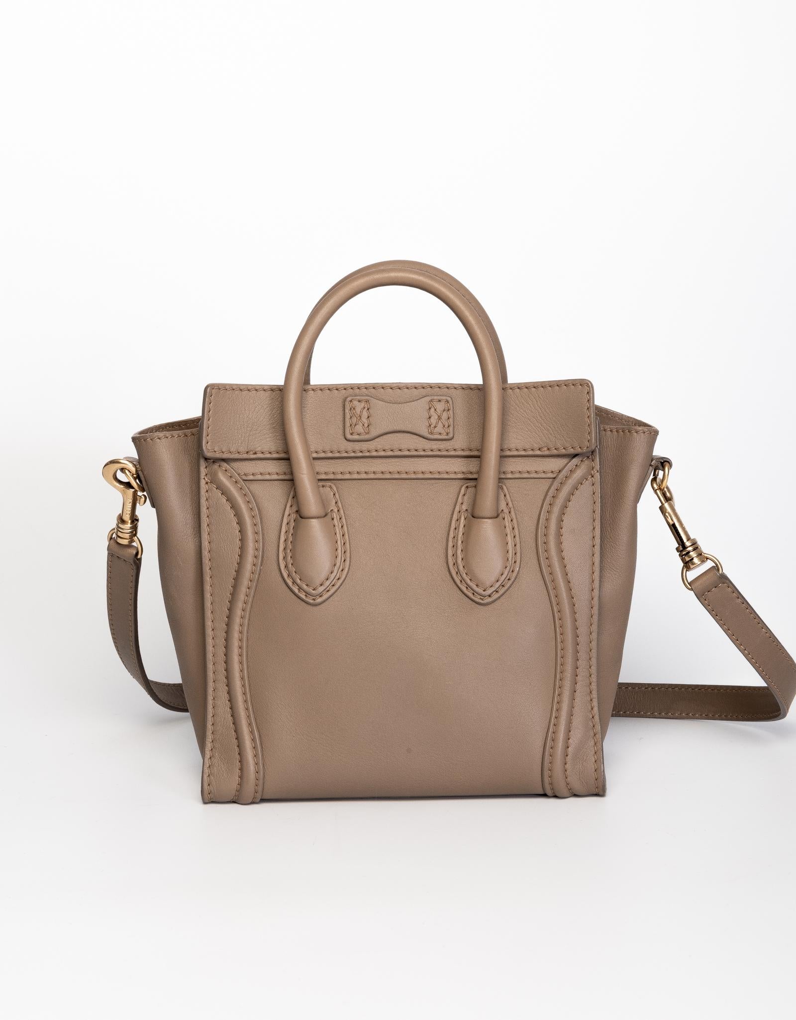 This Celine Nano Luggage bag is made of smooth calfskin leather in sand dune color with gold tone hardware. Featuring leather handles, a removable crossbody strap, top zip closure that opens to cloth lining with a patch pocket.

COLOR: Sand