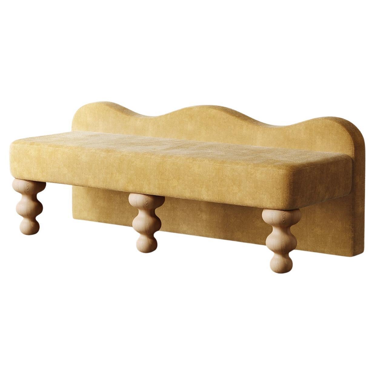 Introducing the Celine Bench, designed with a uniquely shaped scalloped back and solid oak hand-turned legs that complement its elegant curves. Perfectly sized as an end-of-bed bench or for additional seating in a living room or hallway, this bench