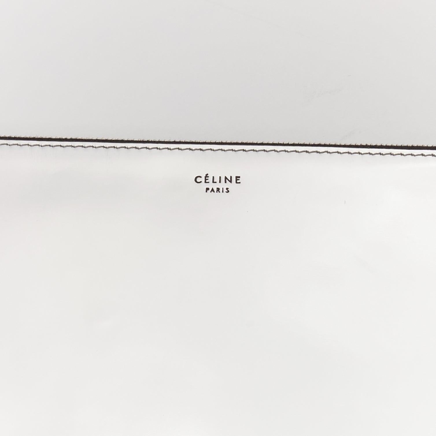 CELINE silver mirrored leather flat O ring zip pouch clutch bag
Reference: BSHW/A00184
Brand: Celine
Designer: Phoebe Philo
Material: Leather
Color: Silver
Pattern: Solid
Closure: Zip
Lining: Black Leather
Extra Details: O ring zip. silver mirror