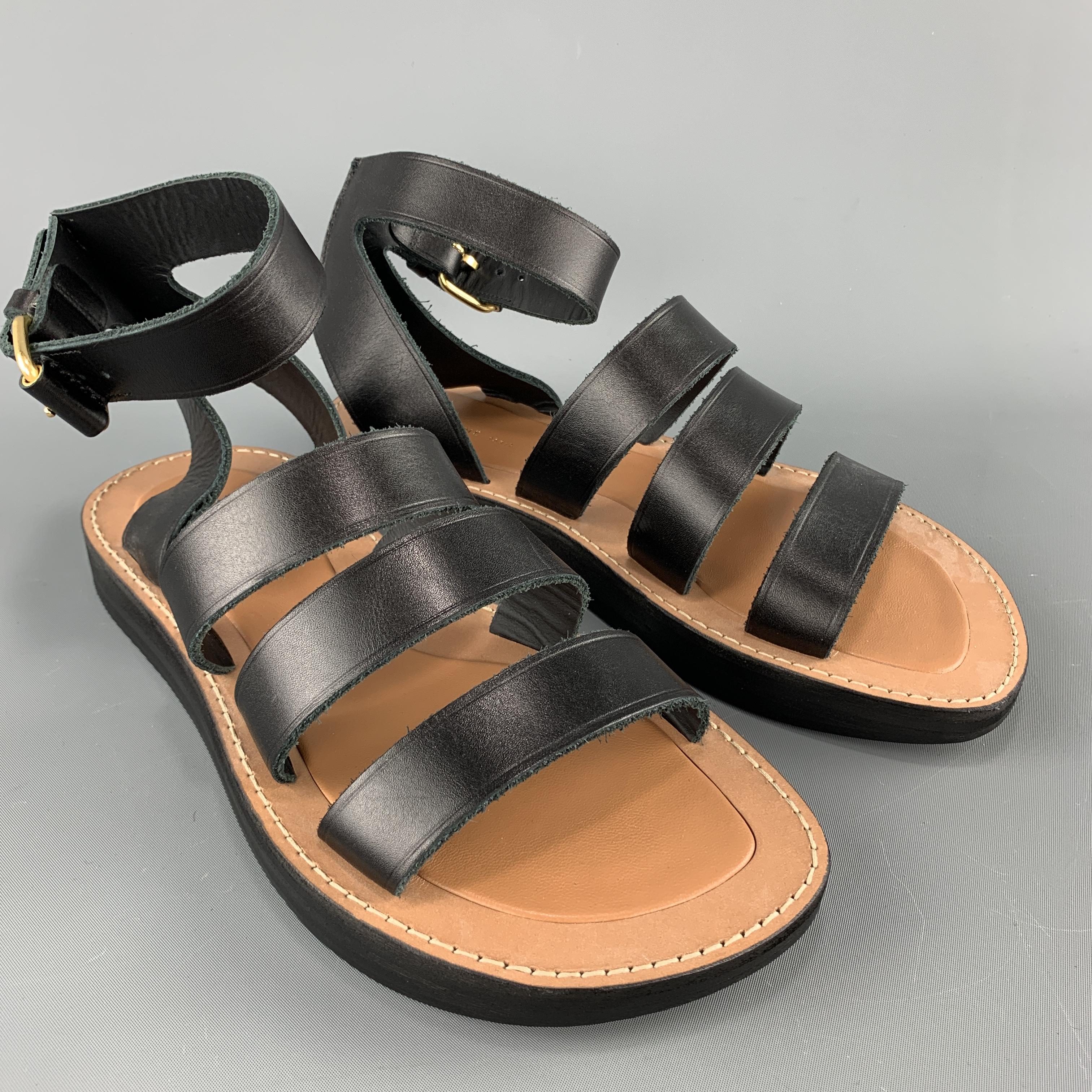 CELINE sandals featured three black toe straps, thick sole, and ankle harness with gold tone buckle. Made in Italy.

Excellent Pre-Owned Condition.
Marked: IT 40