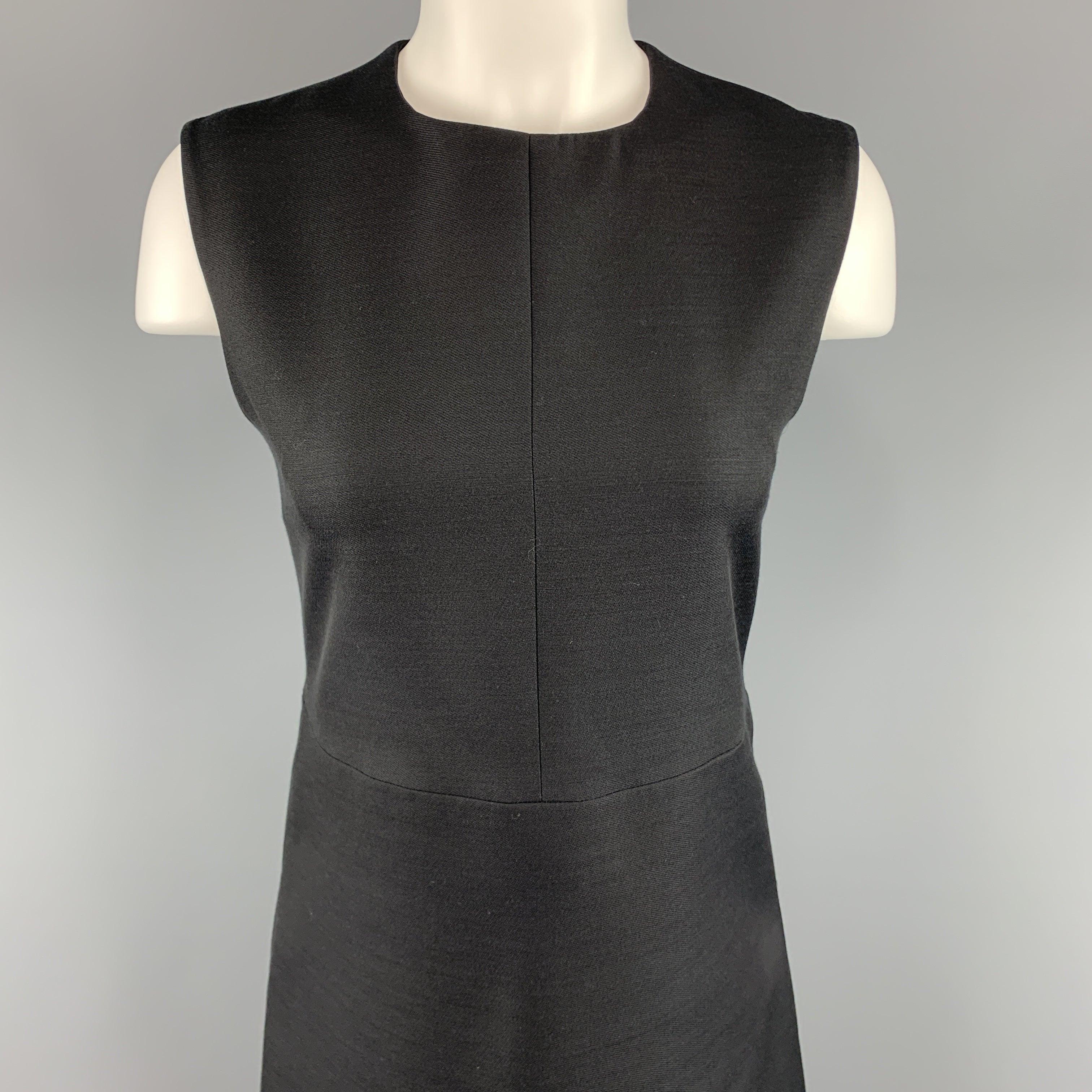 CELINE shift dress comes in a structured woven fabric with a round neckline and A line skirt silhouette. Silk lined. Made in France.Excellent
Pre-Owned Condition. 

Marked:   FR 38 

Measurements: 
 
Shoulder: 14.5 inches Bust:
33 inches Waist:
30