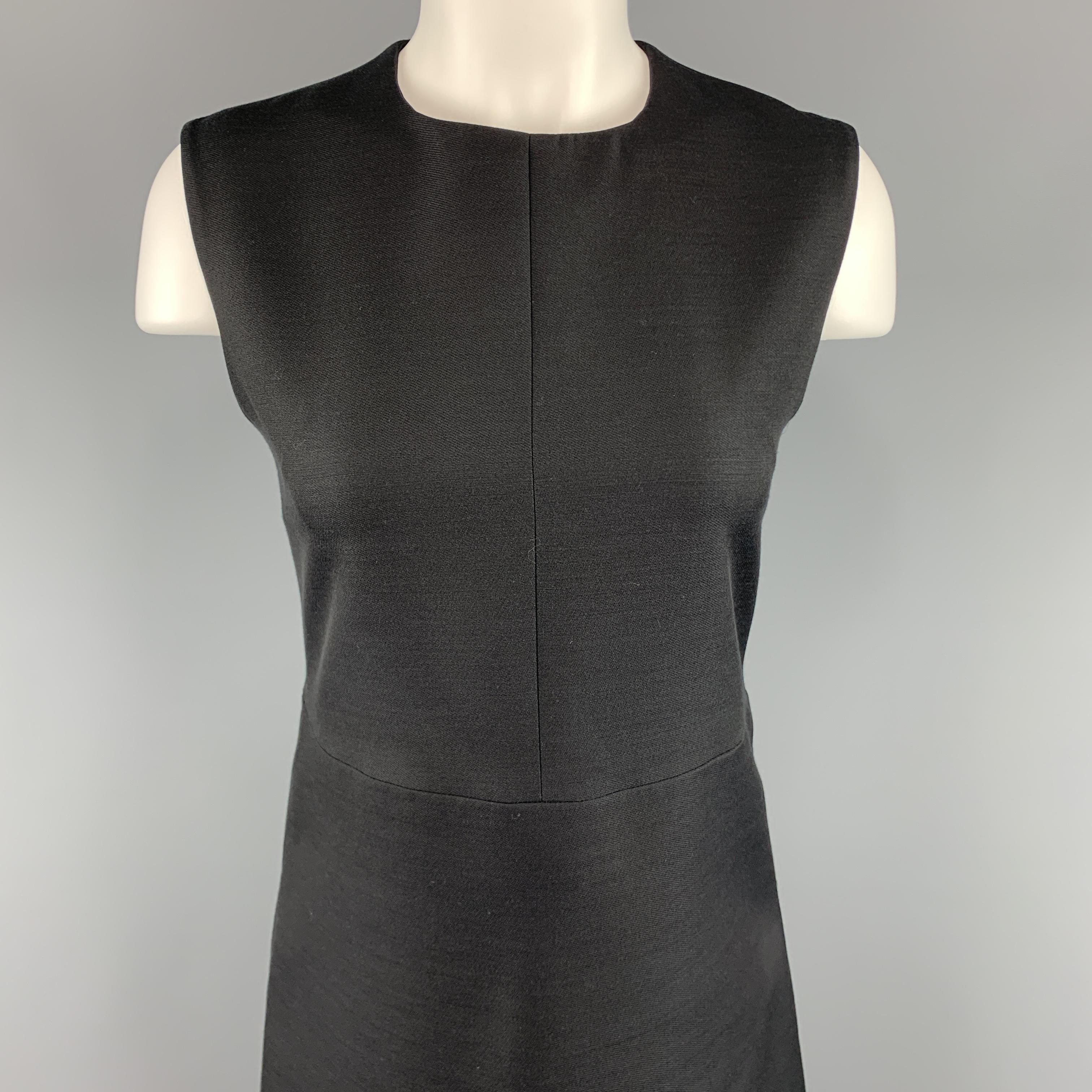 CELINE shift dress comes in a structured woven fabric with a round neckline and A line skirt silhouette. Silk lined. Made in France.

Excellent Pre-Owned Condition.
Marked: FR 38

Measurements:

Shoulder: 14.5 in.
Bust: 33 in.
Waist: 30 in.
Hip: 38