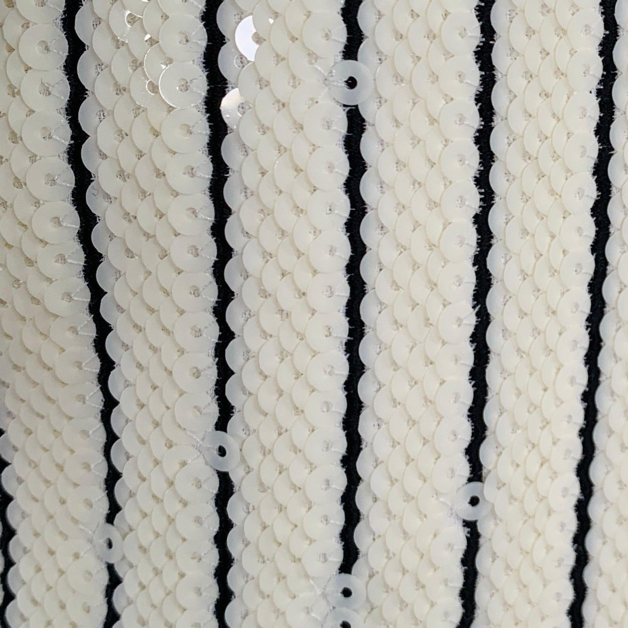 CELINE sport coat
in a beige and black polyester featuring an all over sequined design with stripe details, notch lapel, single vented back, and double button closure. Made in France.New with Tags. 

Marked:   IT 46 

Measurements: 
 
Shoulder: 17