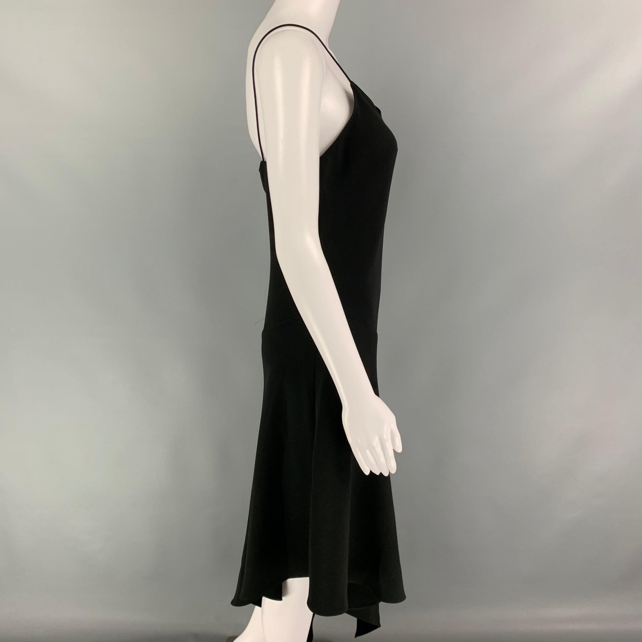 CELINE dress comes in a black stretch silk featuring a asymmetrical design, spaghetti straps, and a slip on style.
Excellent
Pre-Owned Condition. 

Marked:  42 

Measurements: 
 Bust: 32 inches Waist: 26 inches Hip:
32 inches Length: 47 inches 
 
 
