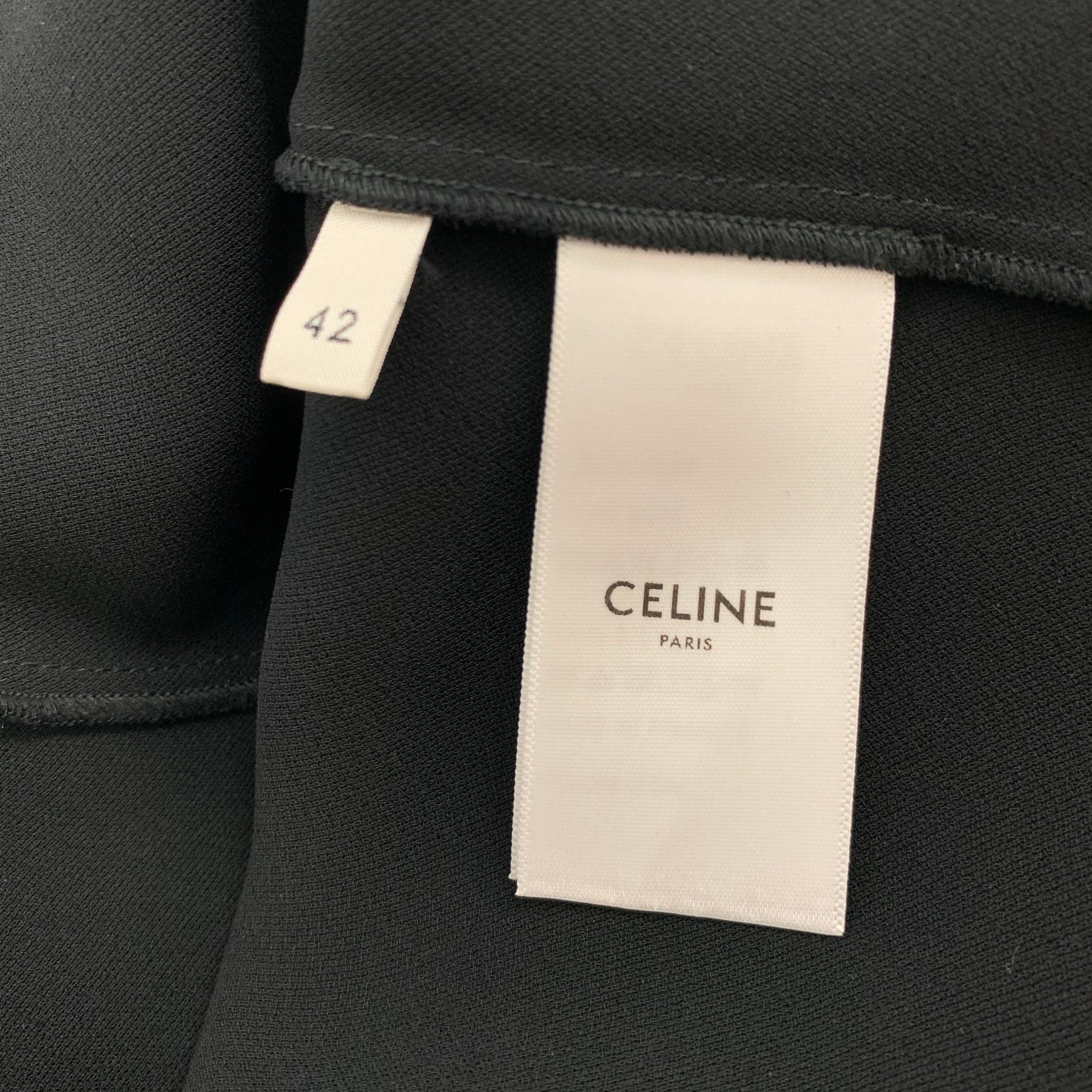 CELINE dress comes in a black stretch silk featuring a asymmetrical design, spaghetti straps, and a slip on style. 

Excellent Pre-Owned Condition.
Marked: 42

Measurements:

Bust: 32 in.
Waist: 26 in.
Hip: 32 in.
Length: 47 in.