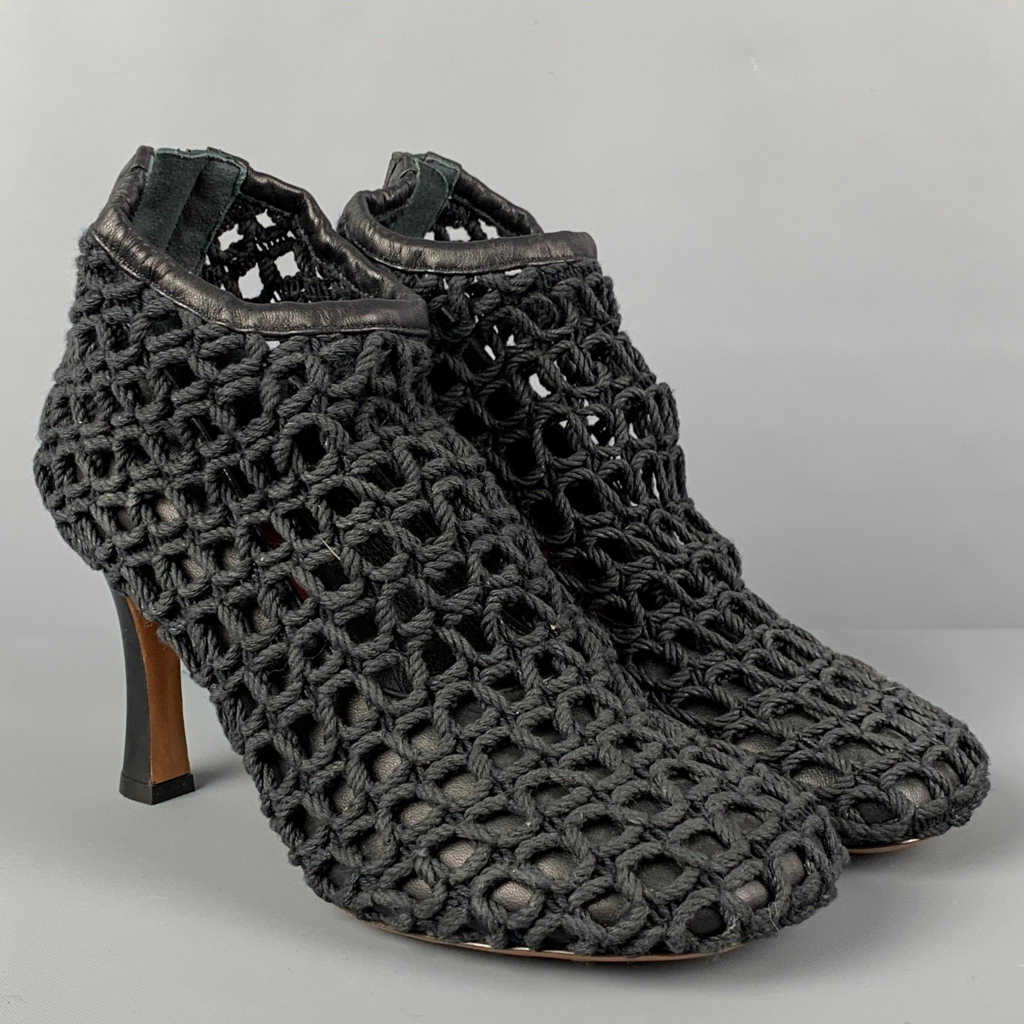 CELINE heels comes in a black woven rope design featuring a leather panel, square toe, back zipper, and a stacked heel. Made in Italy.

Very Good Pre-Owned Condition.
Marked: 37.5
Original Retail Price: $1,100.00

Measurements:

Heel: 3.5 in. 