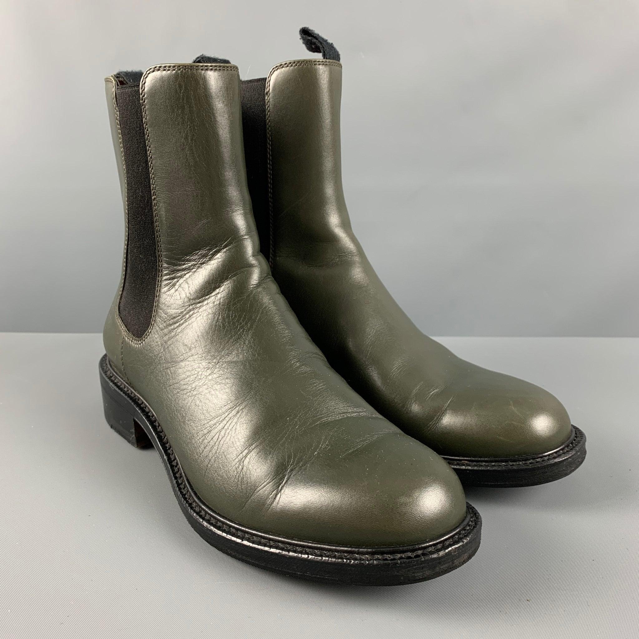CELINE ankle boots comes in a green leather material featuring an elastic panel, black sole. Comes with dust bag. Made in Italy.Excellent Pre-Owned Condition.  

Marked:   37 1/2 

Measurements: 
  Length: 10.75 inches Width: 4 inches Height: 8