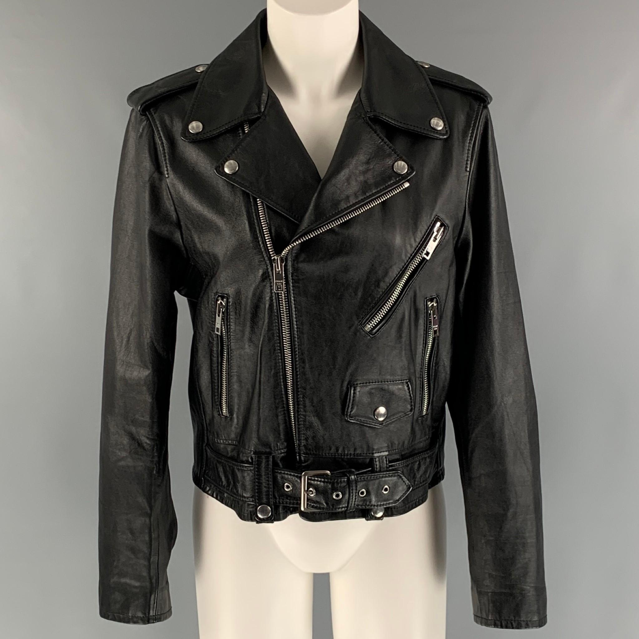 CELINE jacket comes in a black leather featuring a motorcycle style, silver tone hardware, waist belt, epaulettes, and a zip up closure. Made in Italy.

New with tags.
Marked: 44

Measurements:

Shoulder: 17.5 in.
Bust: 41 in.
Sleeve: 24 in.
Length: