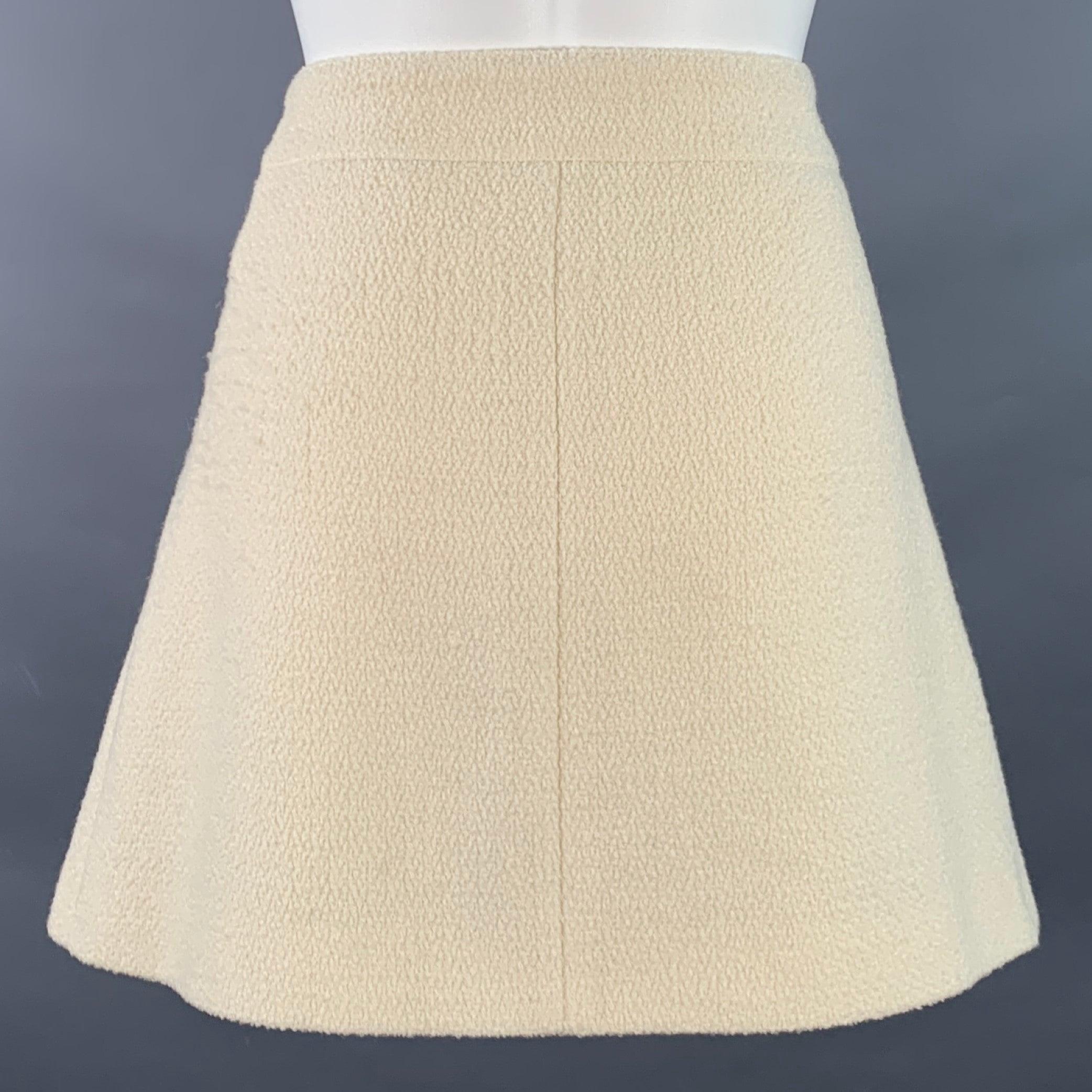 Beige Celine Size 8 Cream Wool Blend Boucle Two Pockets Snaps Mini Skirt en vente