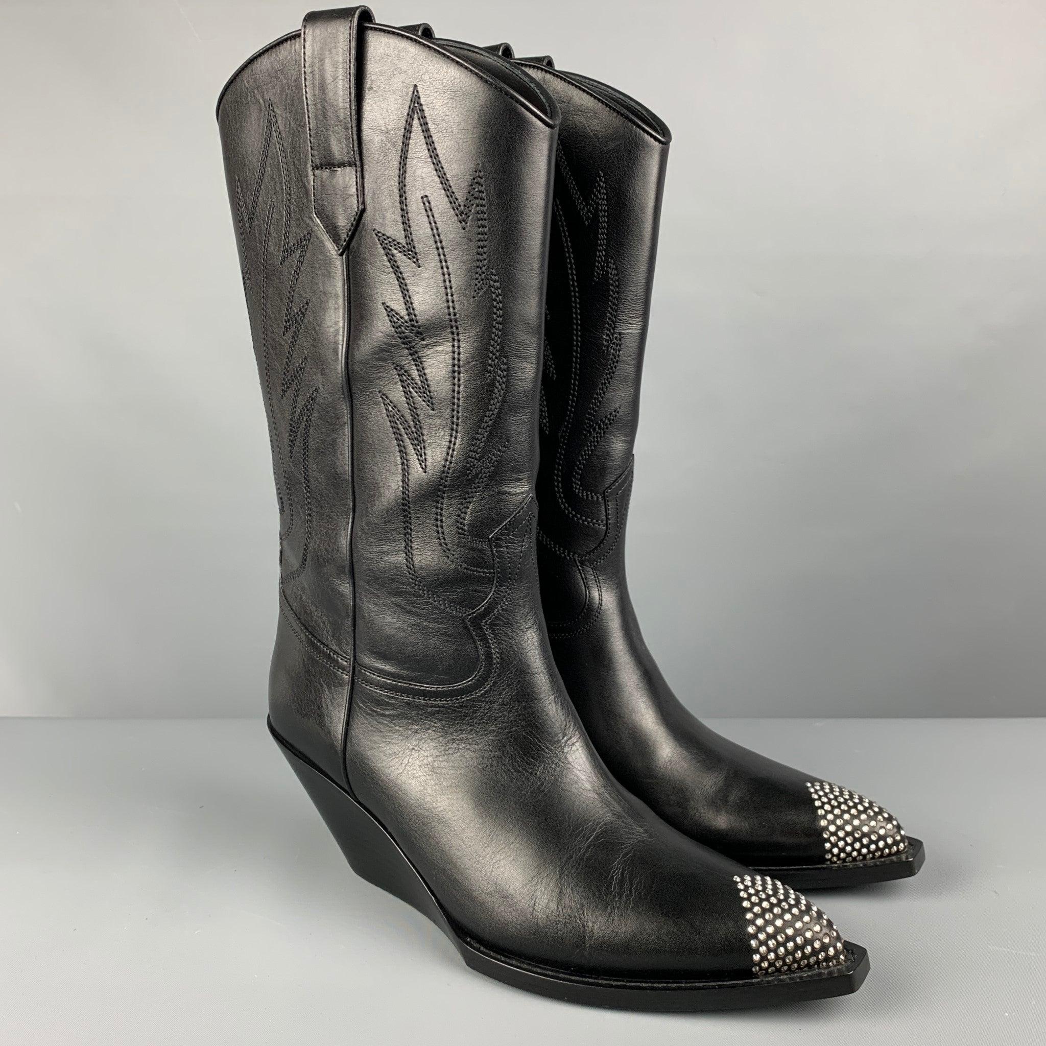 CELINE boots in a black calfskin leather featuring rhinestone toe, and wedge heel.Very Good Pre-Owned Condition. 

Marked:   IT 41 

Measurements: 
  Length: 11.5 inches Width: 4 inches Height: 14.5 inches 
  
  
 
Reference: 127022
Category: