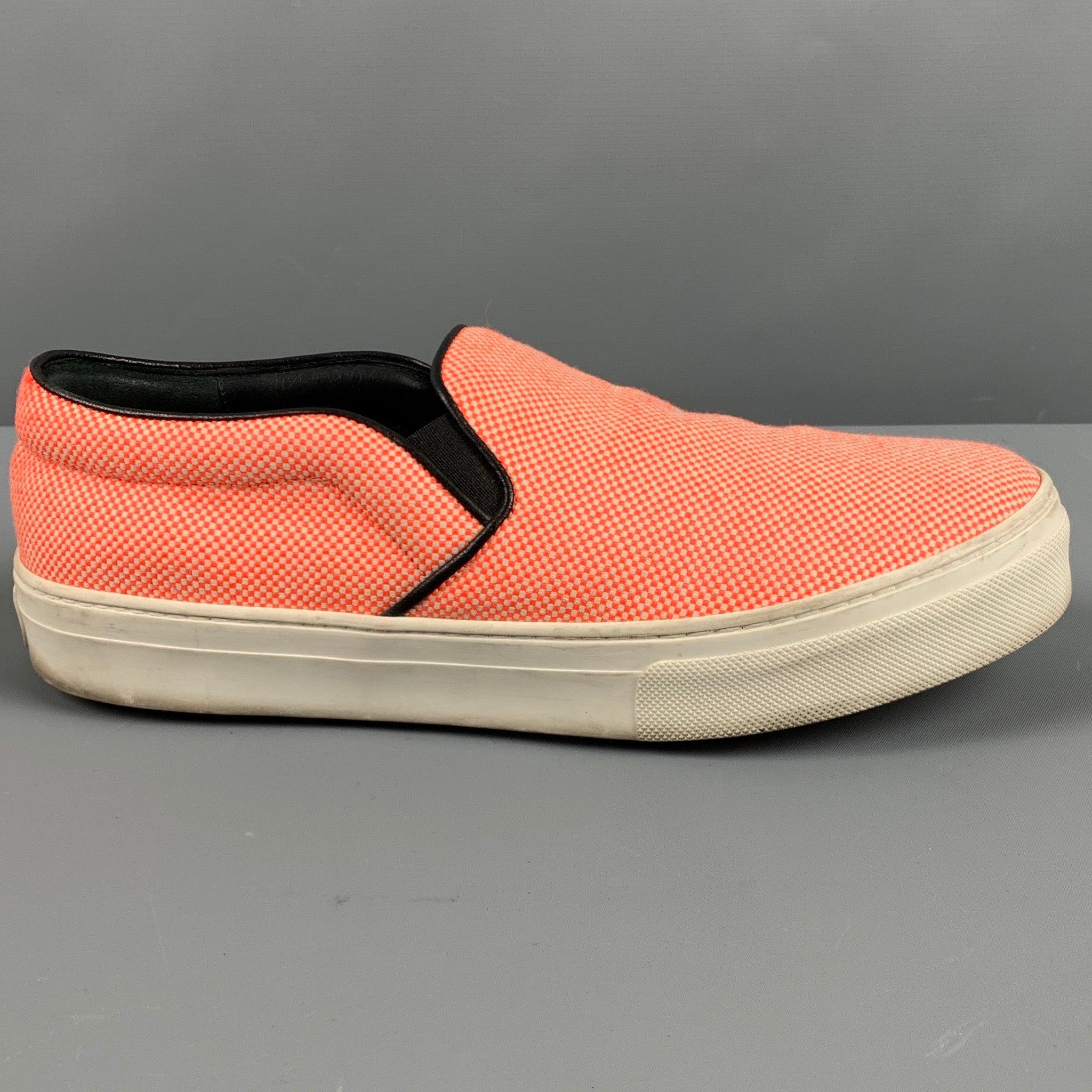 CELINE sneakers
in an orange and white fabric featuring nailhead pattern, slip on style, and rubber sole.
Made in Italy.Very Good Pre-Owned Condition. Moderate marks, as is. 

Marked:   38.5Outsole:10 inches  x 3.5 inches 
  
  
 
Reference: