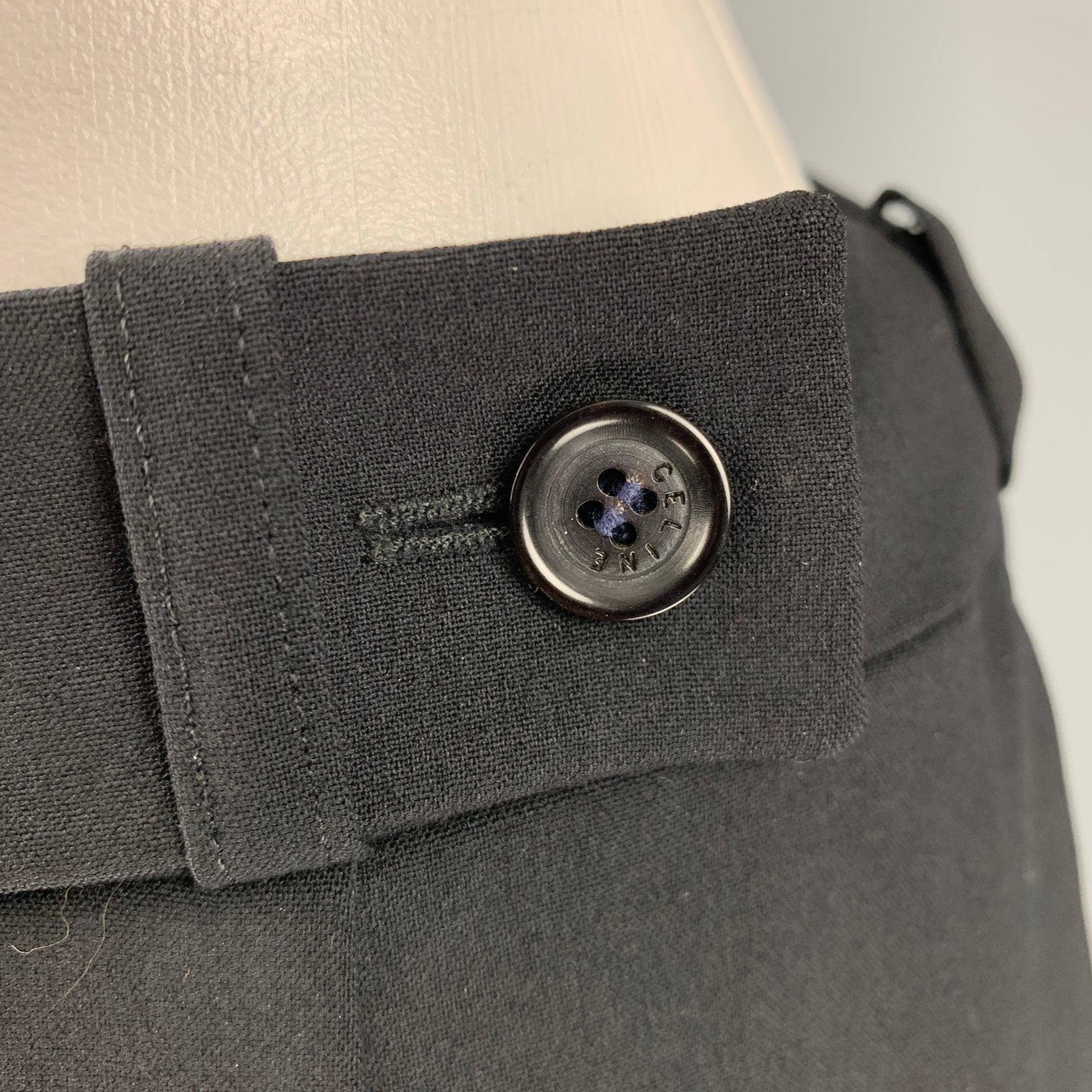 CELINE dress pants
in a black wool blend fabric featuring a wide leg style, and zip fly closure. Made in France.Very Good Pre-Owned Condition. Minor signs of wear. 

Marked:   42 

Measurements: 
  Waist: 30 inches Rise: 9 inches Inseam: 33 inches 
