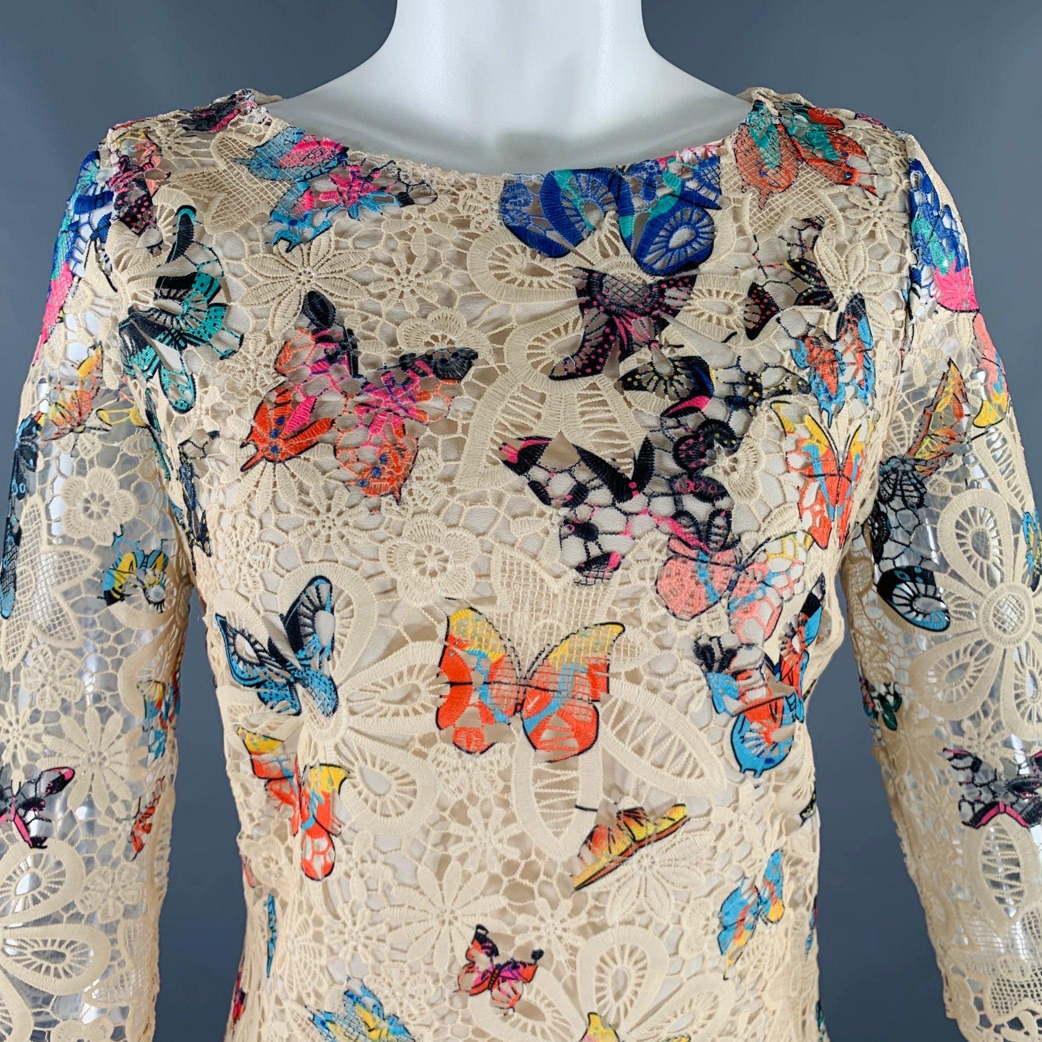 CELINE dress
in a cream and multi-color lace fabric featuring a floral design with printed butterflies, 3/4 sleeves, and side zipper closure.Excellent Pre-Owned Condition. 

Marked:   size not marked, fabric tags removed. 

Measurements: 
