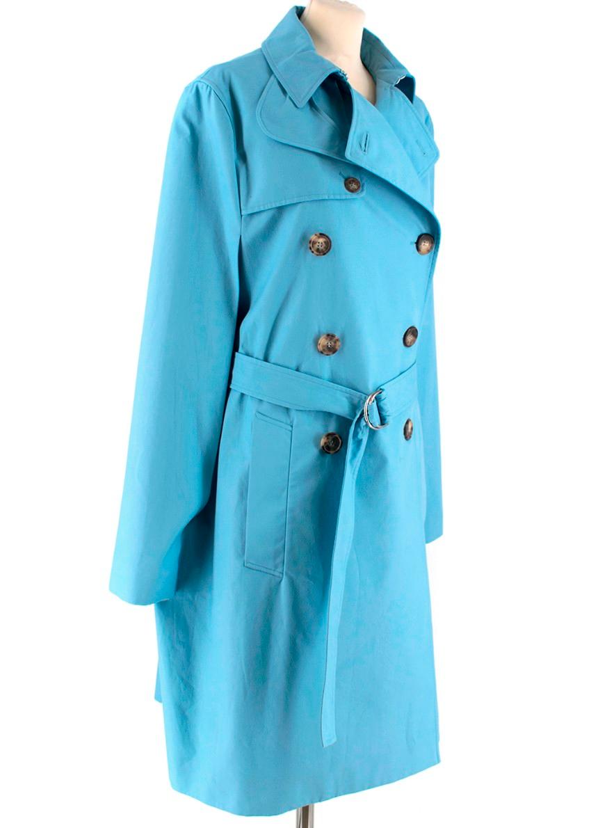 Celine Sky Blue Cape Trench Coat

- Double Breasted 
- Tortoiseshell Large Buttons
- Belt with silver-tone fastener 
- Cape style sleeves attached to main body
- 100% Heavy cotton 
- 2 Pockets 
- Pointed collar 
- Hook fastening around collar
-