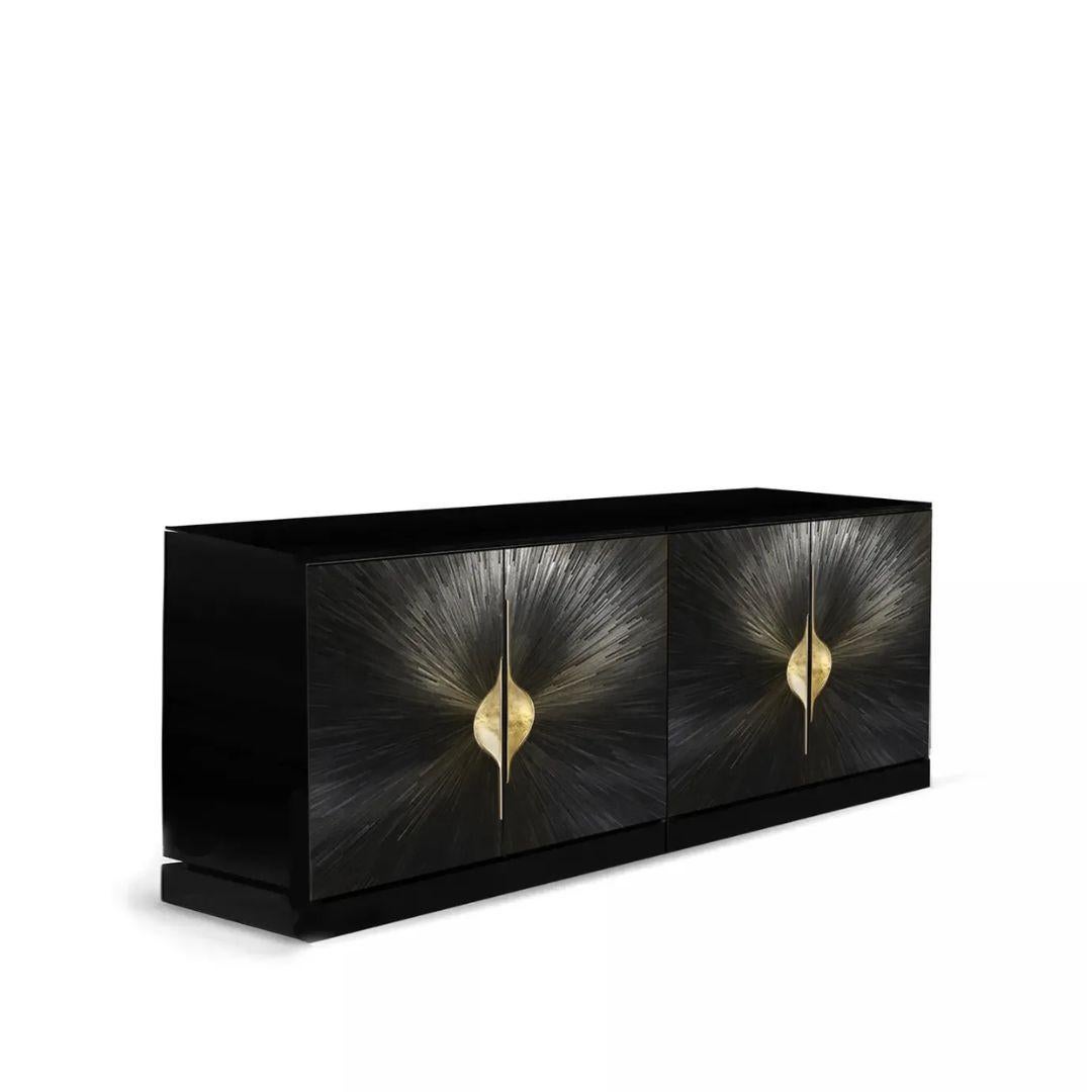 The Celine Straw Cabinet is a refined expression of contemporary artistry and craftsmanship. Its doors feature intricate straw marquetry in a radiant sunburst pattern, brought to life with gracefully curved cast brass handles. Bold yet timeless, the
