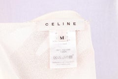 Celine-Pullover mit Druckknöpfen an den Ärmeln