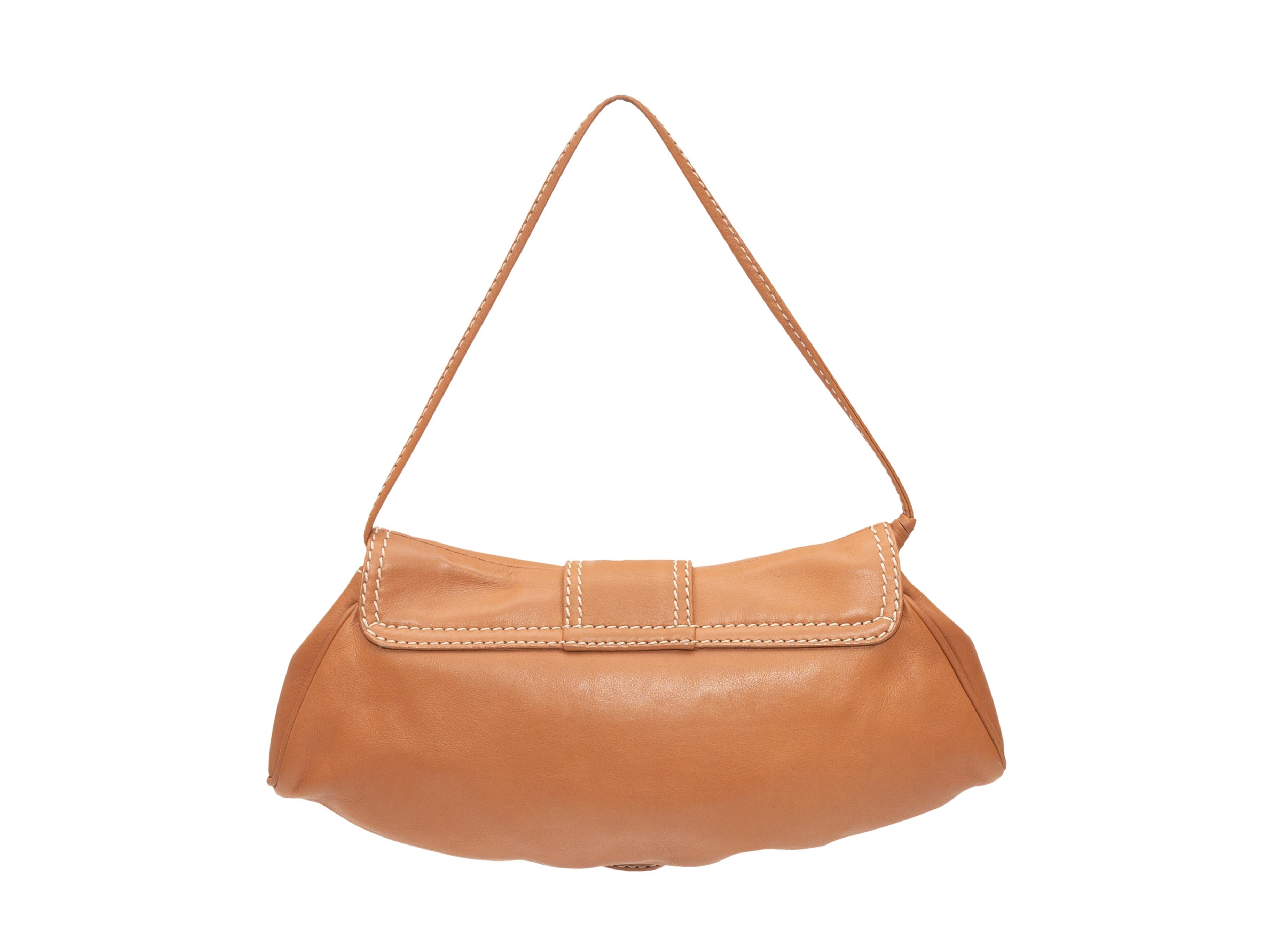 Product details: Tan leather mini flap shoulder bag by Celine. Circa 2004. Gold-tone hardware. Contrast stitching throughout. 10