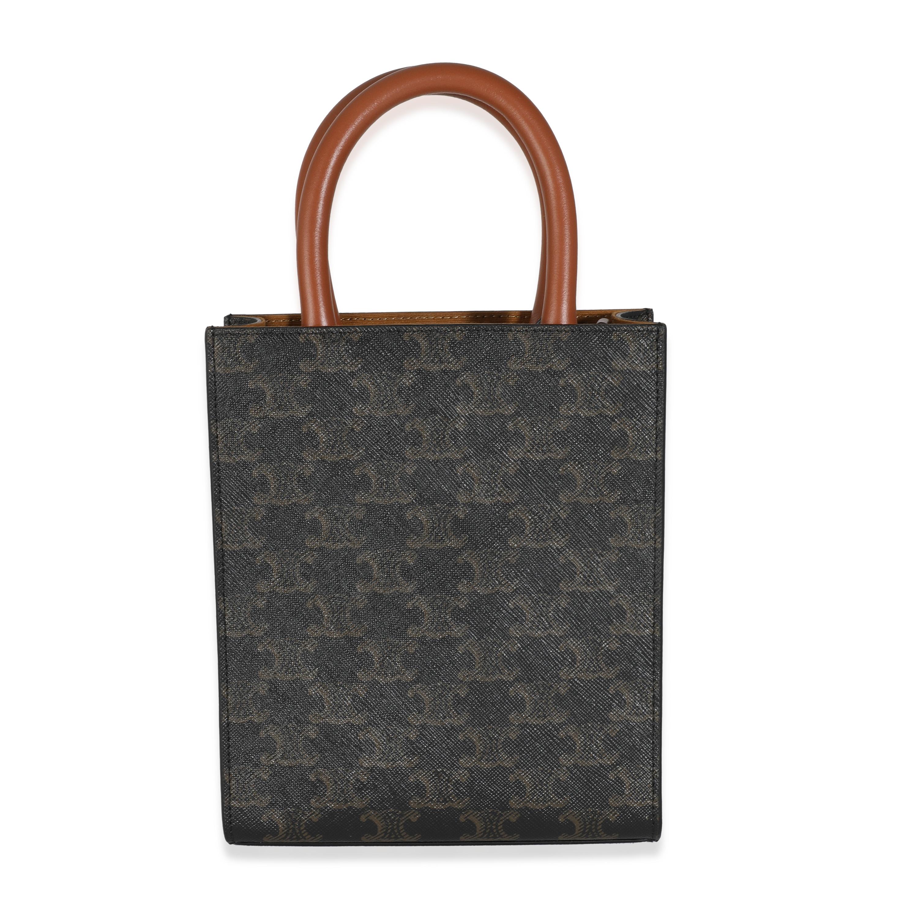 Listing Title: Celine Tan Calfskin Triomphe Canvas Mini Vertical Cabas Tote
SKU: 143976
MSRP: 1550.00 USD
Condition: Pre-owned 
Condition Description: The Luggage tote bag was introduced with Phoebe Philo's first collection for Celine in 2010. Since