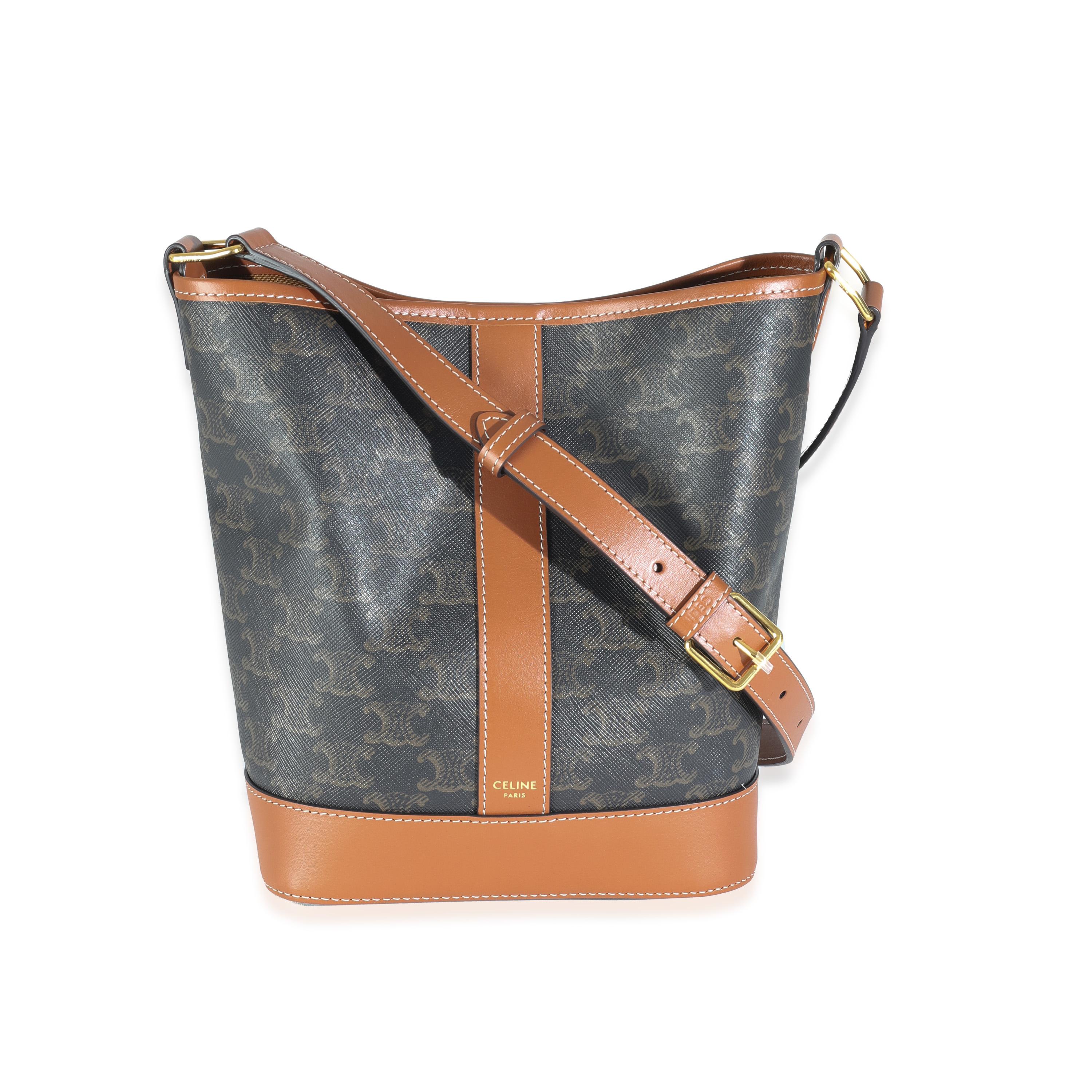 Listing Title: Celine Tan Calfskin Triomphe Canvas Small Bucket Bag
SKU: Z144456
MSRP: 1700.00 USD
Condition: Pre-owned 
Handbag Condition: Pristine
Condition Comments: Item has no indication of wear.  Final sale.
Brand: Celine
Model: Small Bucket
