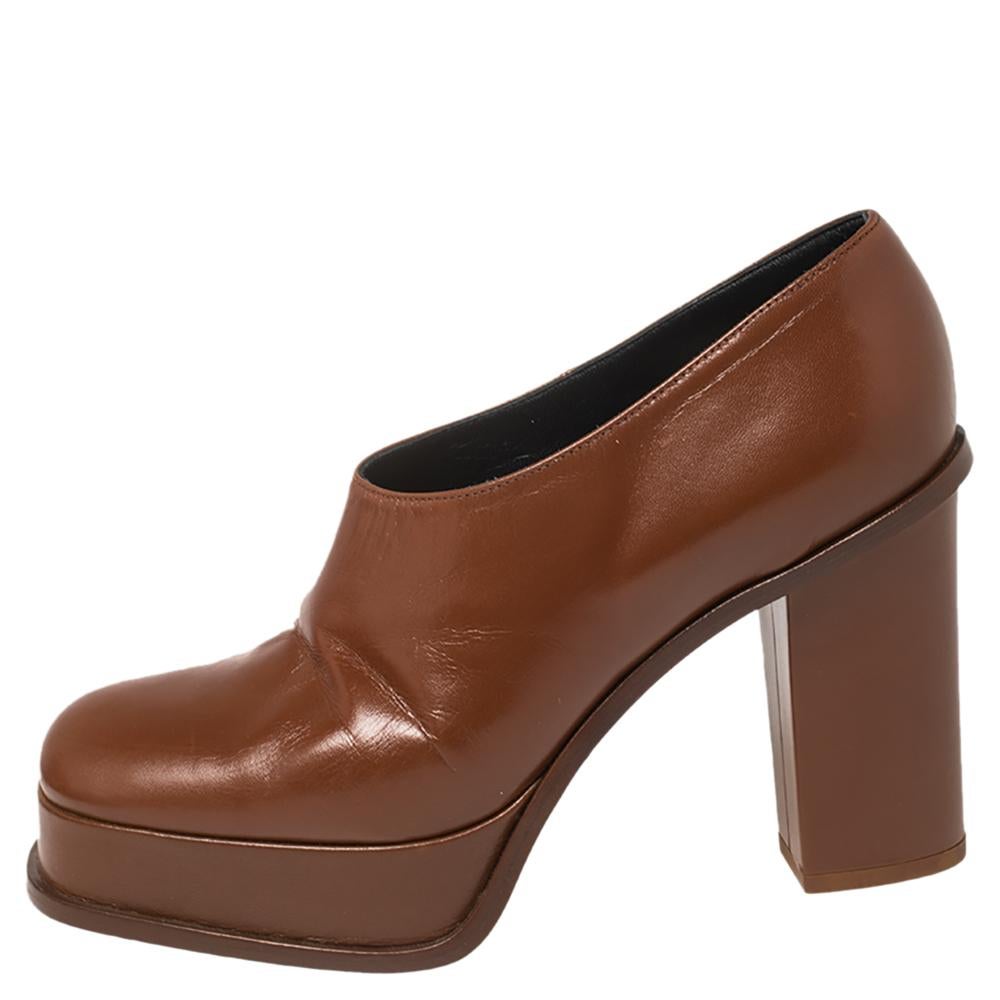 Exuding a sense of understated style and an old-world charm these Celine booties are masterpieces that can elevate a simple outfit. They have been crafted from tan leather and feature square toes. They come with platforms and 10 cm heels.

