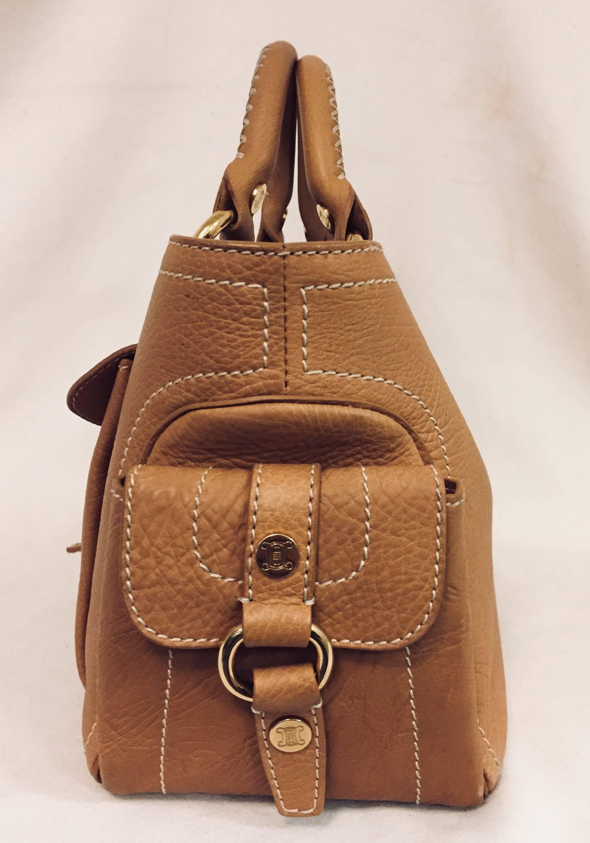 Céline, a visionary fashion house, stands out with inspired collections that are sophisticated and unique.  This house created in 1945  has continued evolving designing elegant leather goods in this century.  This Celine tan leather satchel is in