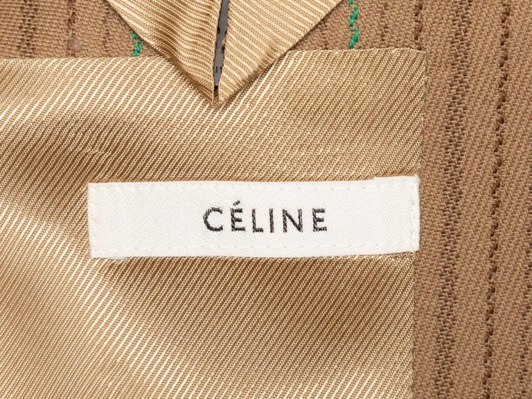 Product Details: Tan and multicolor pinstriped wool blazer by Celine. Notched lapel. Three pockets. Single button closure at front. Designer size 38. 36