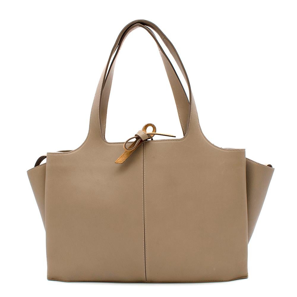 Celine Medium Pale Beige Tote

- Smooth calfskin with structure
- Very spacious bag with zipped middle compartment & attached card holders
- Tanned suede
- Tied panel for security
- Boxy look with signature overflowing side panels
- Light silver