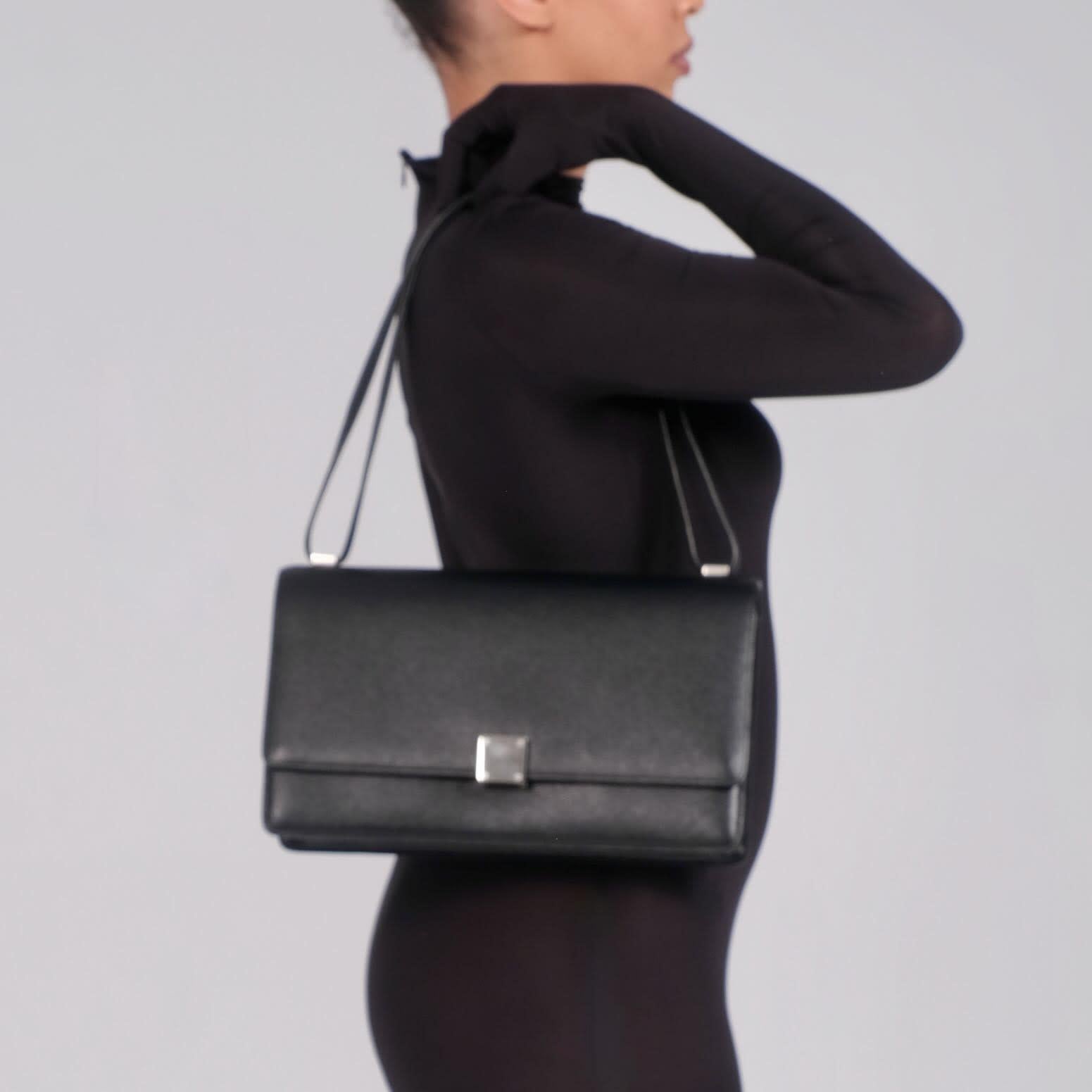 Color: Black
Material: Grained leather
Condition: Very good.
Made in France

Measurements~
Height 7.5”
Width 12.5”
Depth 4