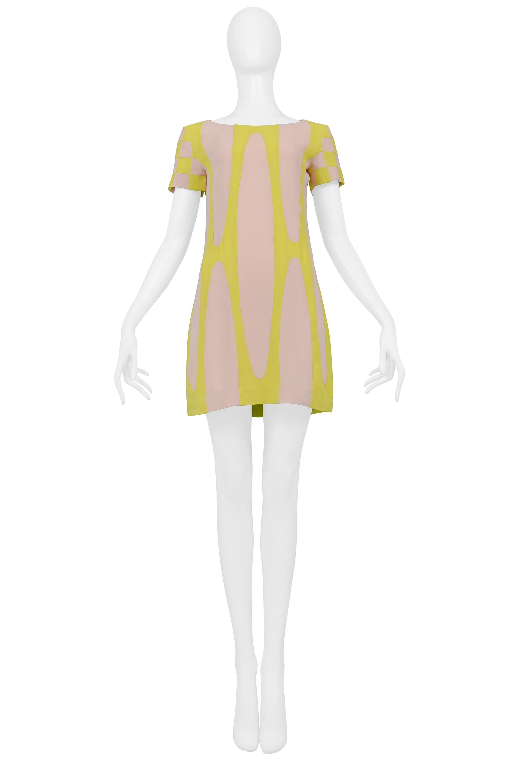 Resurrection Vintage is excited to offer a vintage Celine open back yellow and pink dress featuring decorative circular pattern, a high neck, ruffle detail on back, open back, and mini dress length. 

Celine
2005 collection by Roberto
