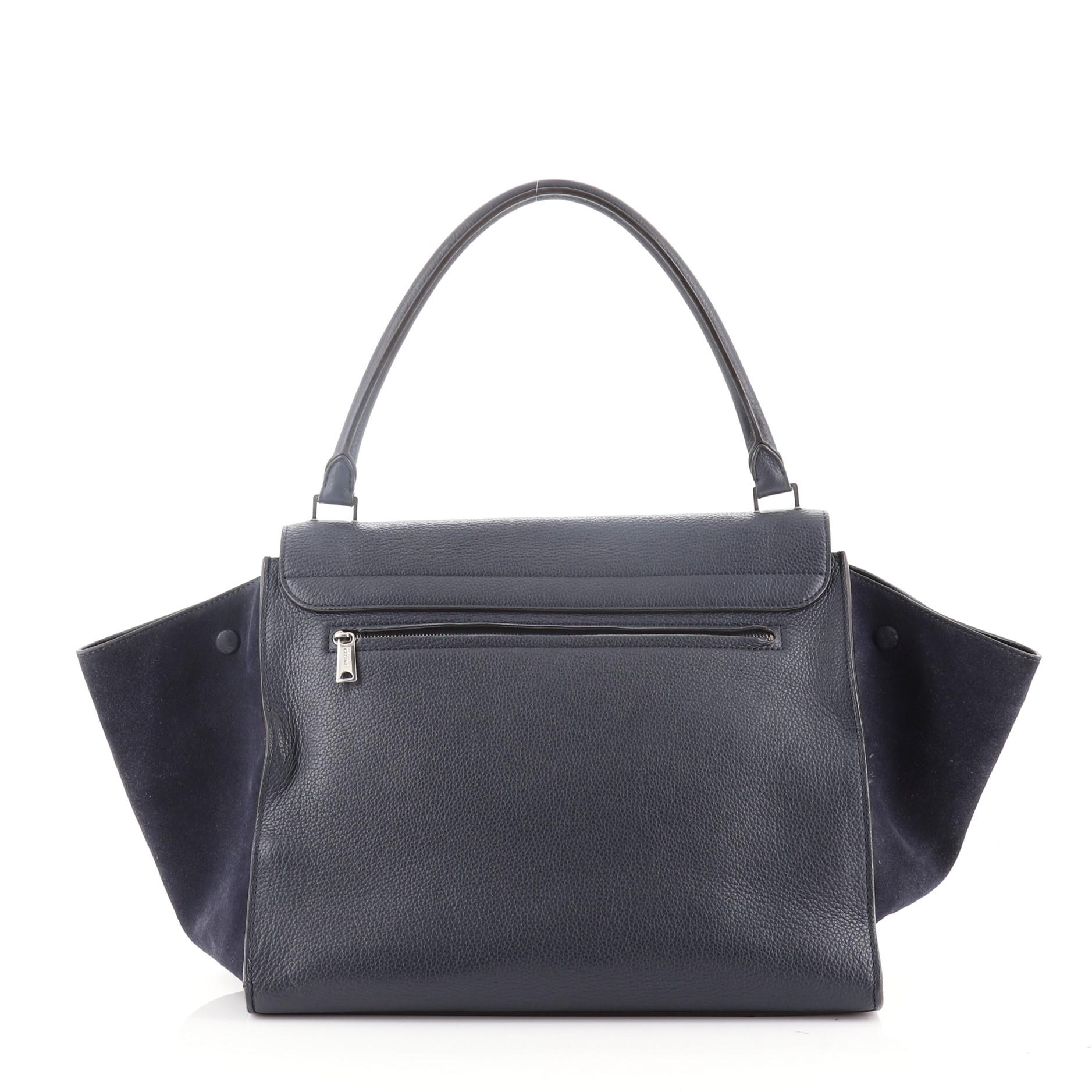 Celine Trapeze Bag Leather Large
Blue Leather

Condition Details: Moderate creasing, scuffs and wear on exterior and underneath flap, cracking on exterior and opening wax edges. Scuffs, wear and small indentations in interior, scratches and tarnish