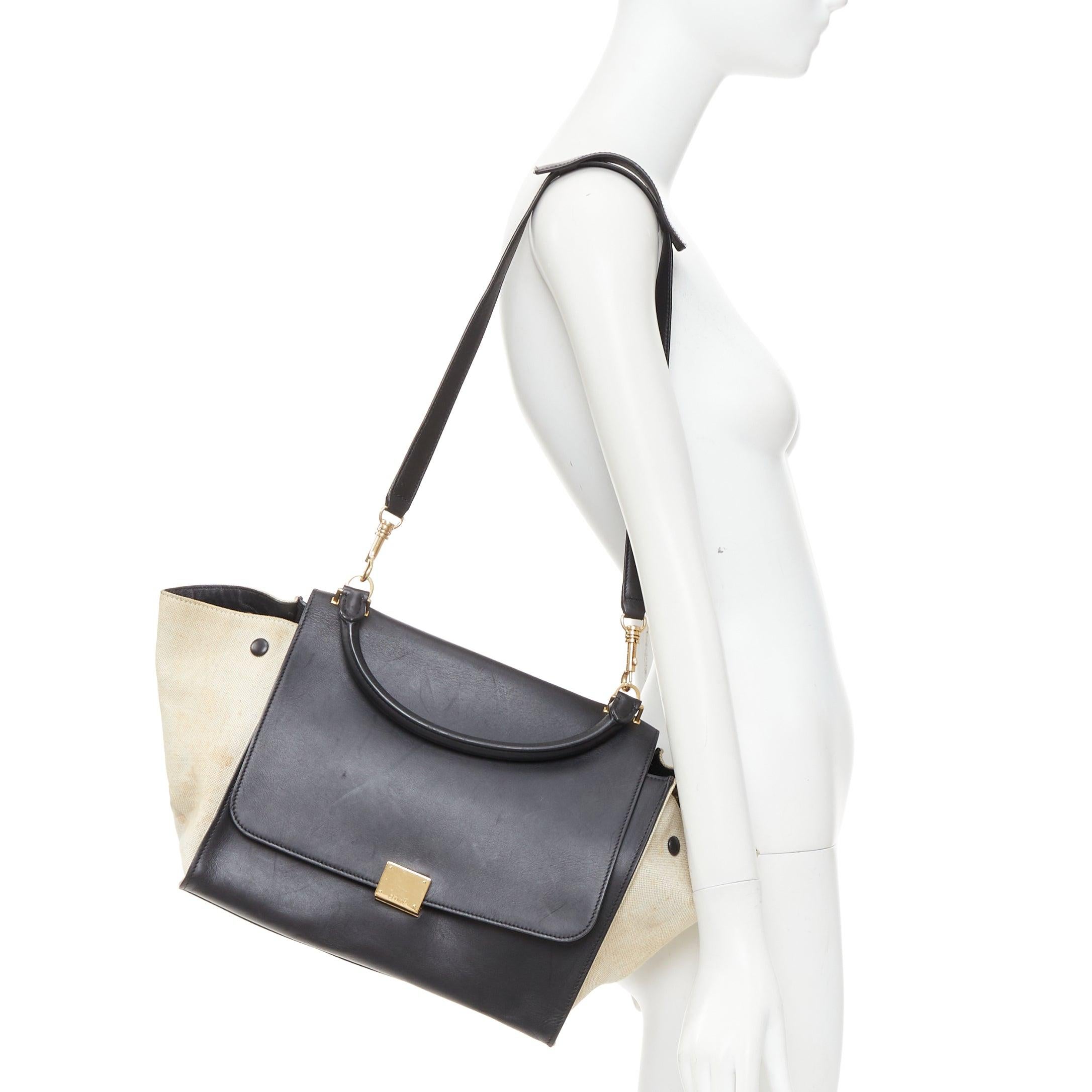 CELINE Trapeze black smooth leather cream canvas crossbody satchel bag
Reference: ECLO/A00155
Brand: Celine
Designer: Phoebe Philo
Model: Trapeze
Material: Leather, Canvas
Color: Black, Cream
Pattern: Solid
Closure: Clasp
Lining: Black Leather
Extra