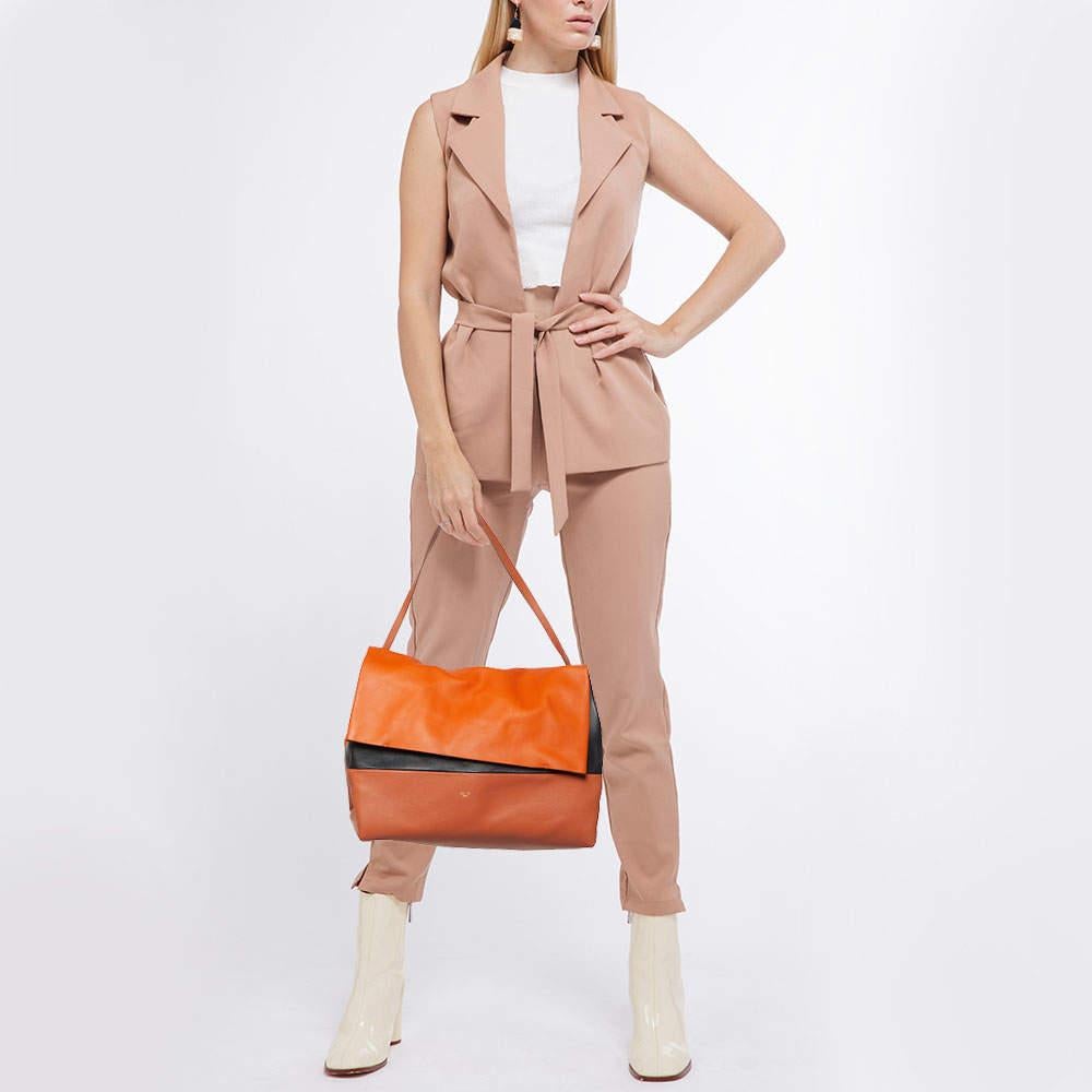 Structured, sophisticated, and stylish are some words that describe this shoulder bag! Crafted from the best quality material, the creation is adorned with the label's signature appeal and equipped with a well-spaced interior. Carry it to parties or